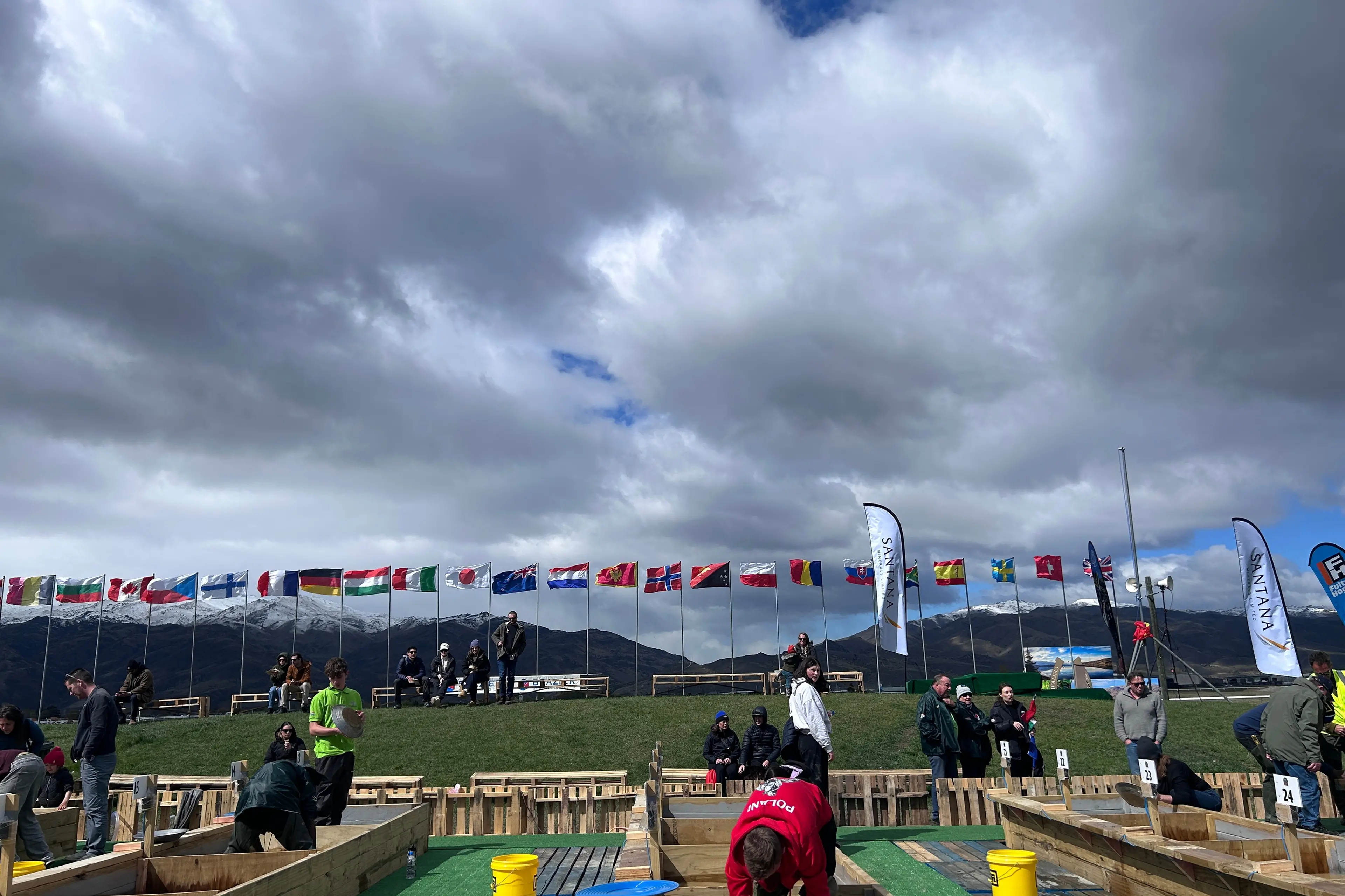Flags from 20 countries are buffeted by blustery conditions at the site of the World Gold Panning Championships, in Cromwell, at the market and have-a-go-day on Sunday. The international contest begins today. Photo: Julie Asher