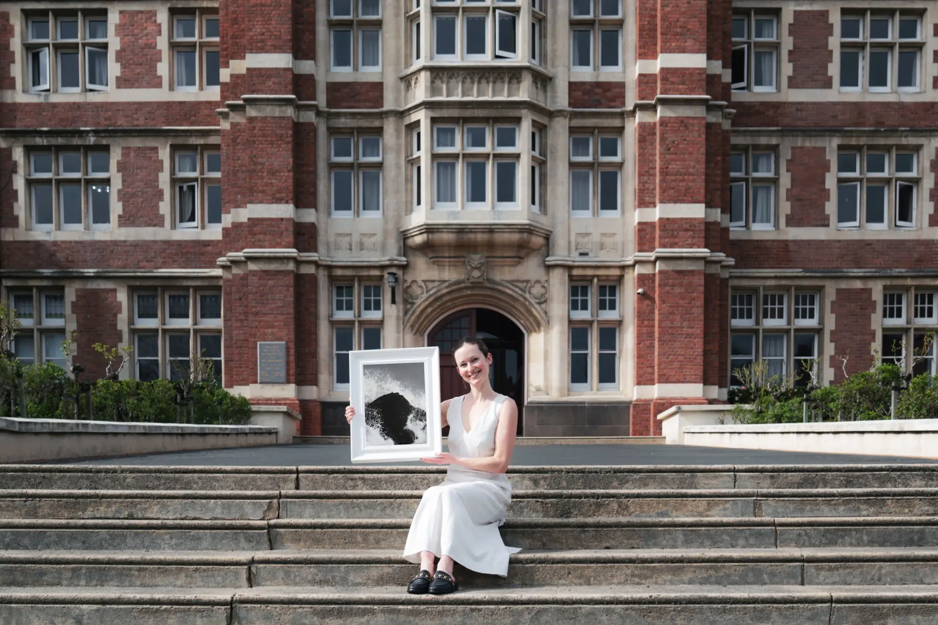 Knox College artist in residence Ruby Burke displays her work on the college\\'s steps. Photo: Supplied