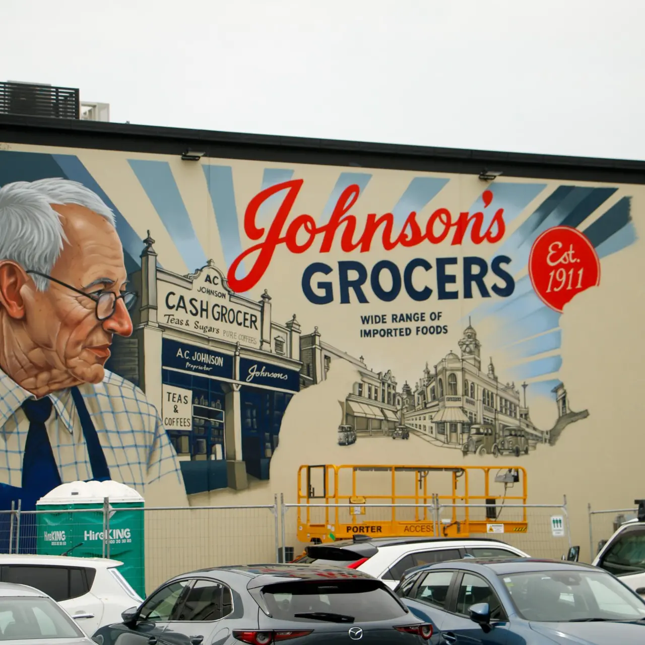 Mural updated to show Johnson’s Grocers store