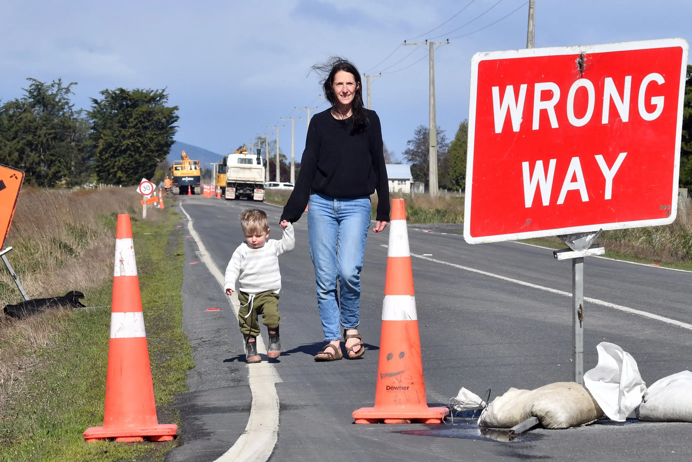 Deli Frampton and son Freddy Frampton, 1, try to walk down Centre Rd. Photo: Stephen Jaquiery