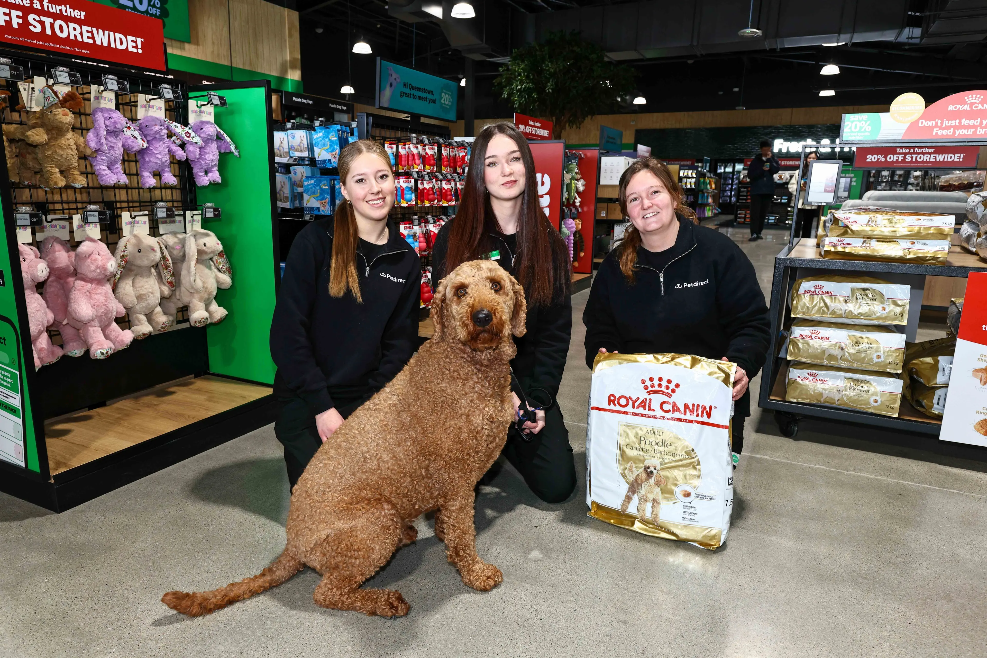 Pampering your pets: Petdirect staff, from left, Mileka Naus, Emma Traill and Hannah McInally along with Ted. Photo: Supplied