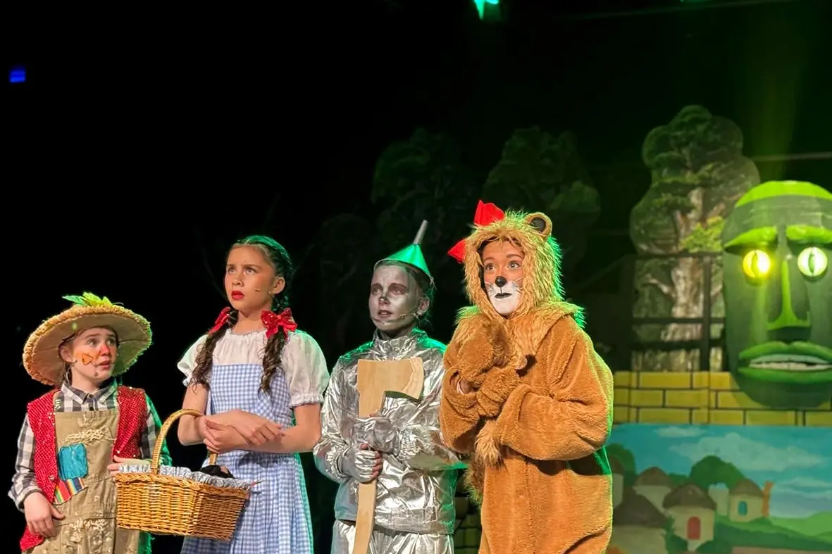 Taking to the yellow brick road in the \\'The Wizard of Oz\\' production are (from left) Charlotte Shearer as Scarecrow, Roma McCambridge as Dorothy, Stevie Faulkner as Tin Man and Cassie Compton as Lion. Photo: Supplied