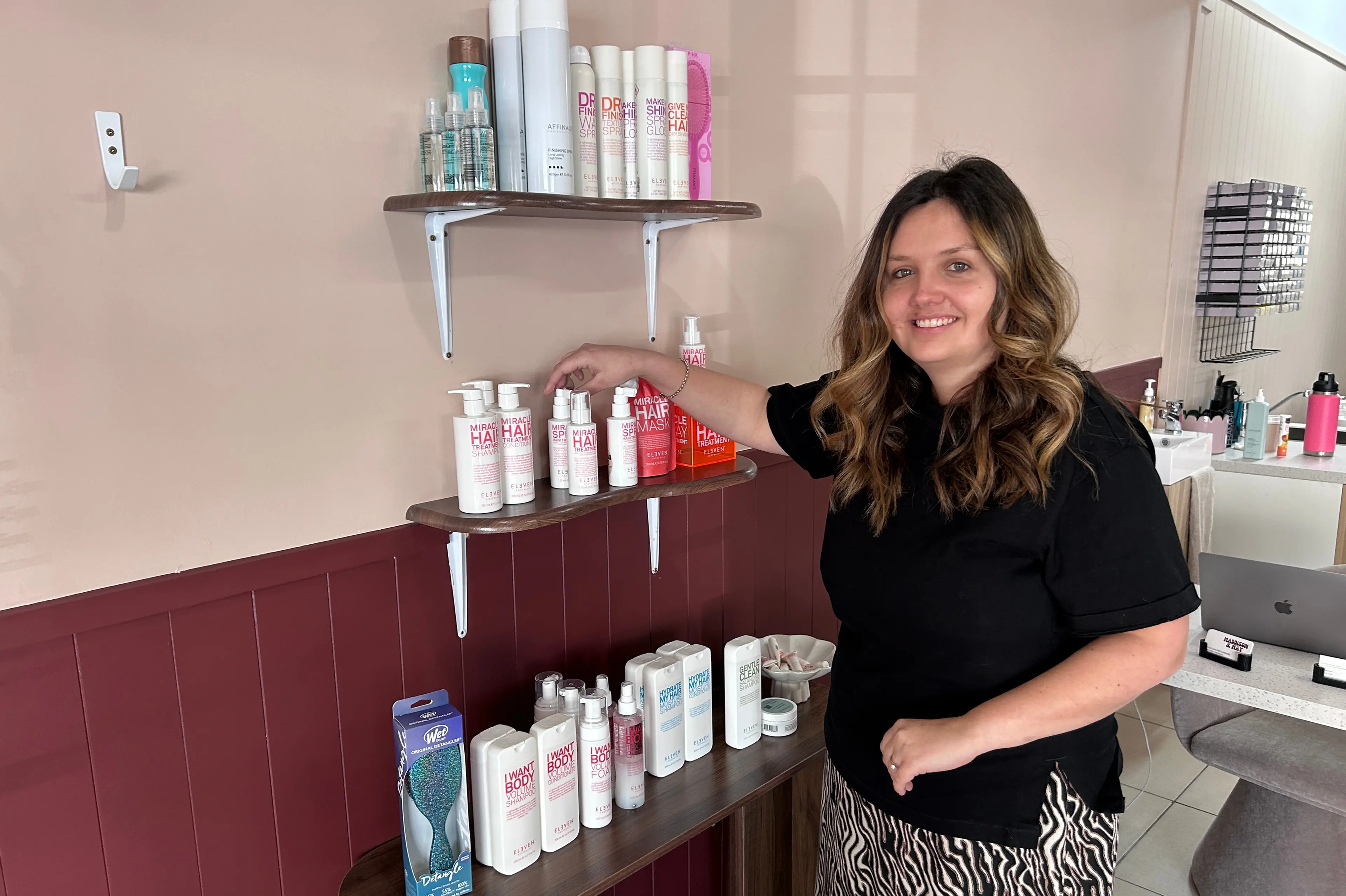 Roxburgh hairdresser Emma Piper arranges product in her new salon in the town. Opening Maddison and May came about as the result of 14 years of hairdressing and both her children now being at school, she said. Photo: Julie Asher