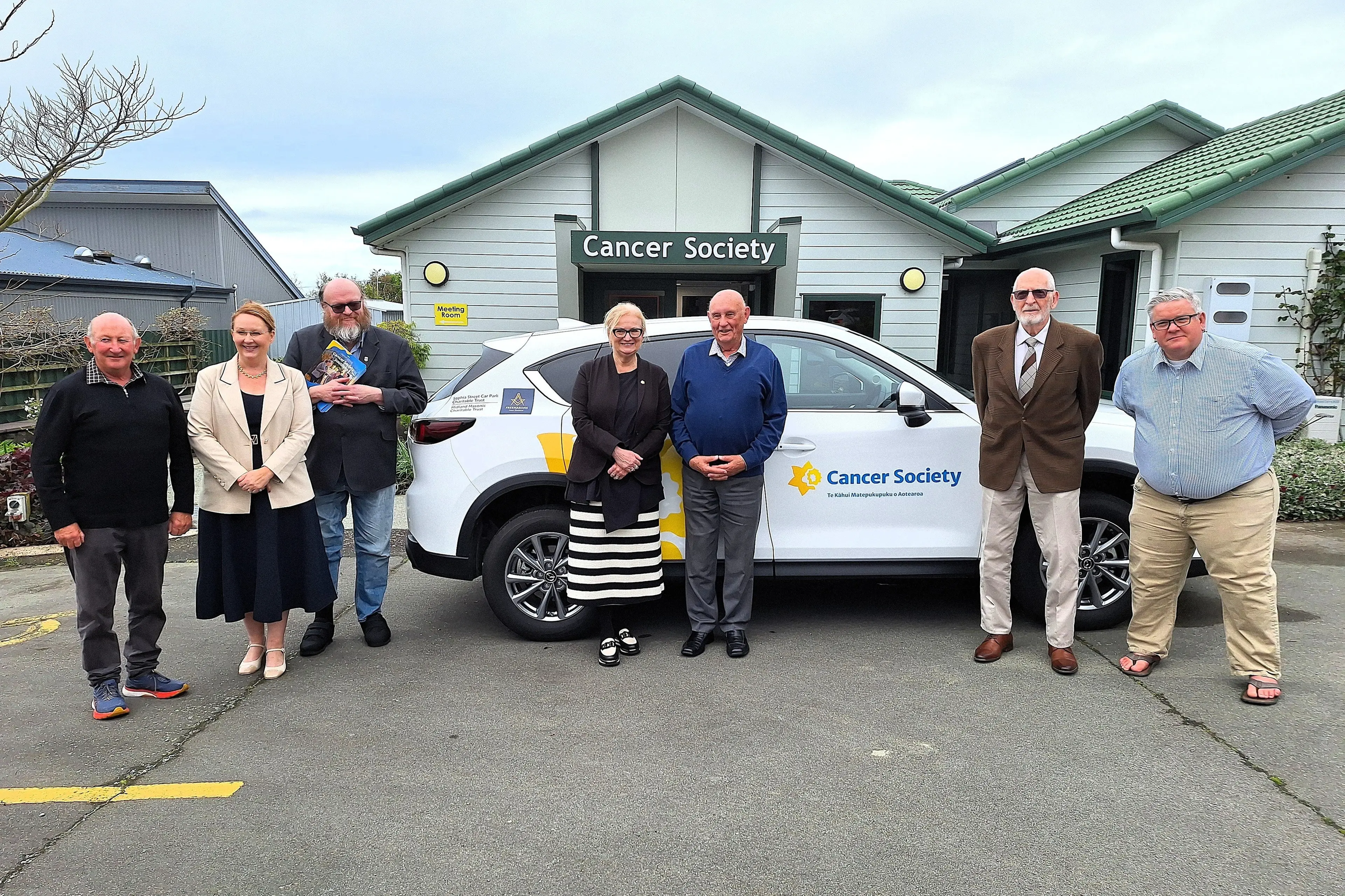 Admiring the new Midland Masonic Charitable Trust and the Sophia Street Car Park Charitable Trust signage on the Cancer Society car are (from left) Gary Wakefield, Sonia Sullivan, Jeff Elston, Christine Prince, Paul Johnston, Jim Mundow and Nik Huddart. Photo: Supplied