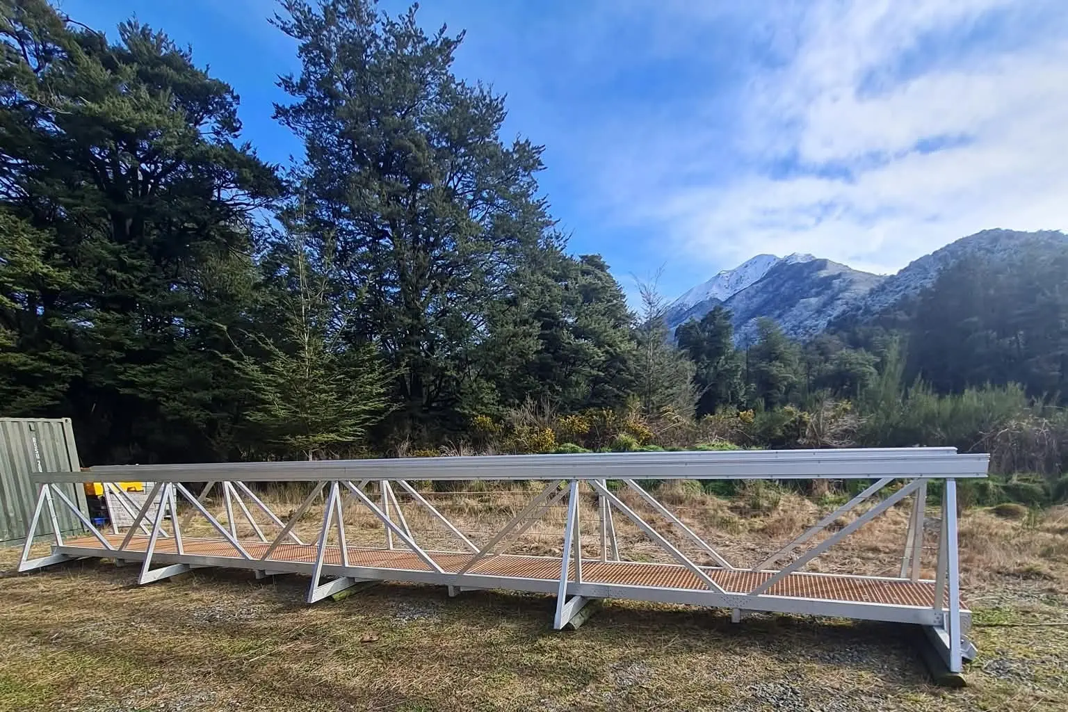 The 11.5 meter aluminium bridge will be installed over the unpredictable Pony Stream next month. Once the foundations are put in a helicopter will lower it in to place. Photo supplied