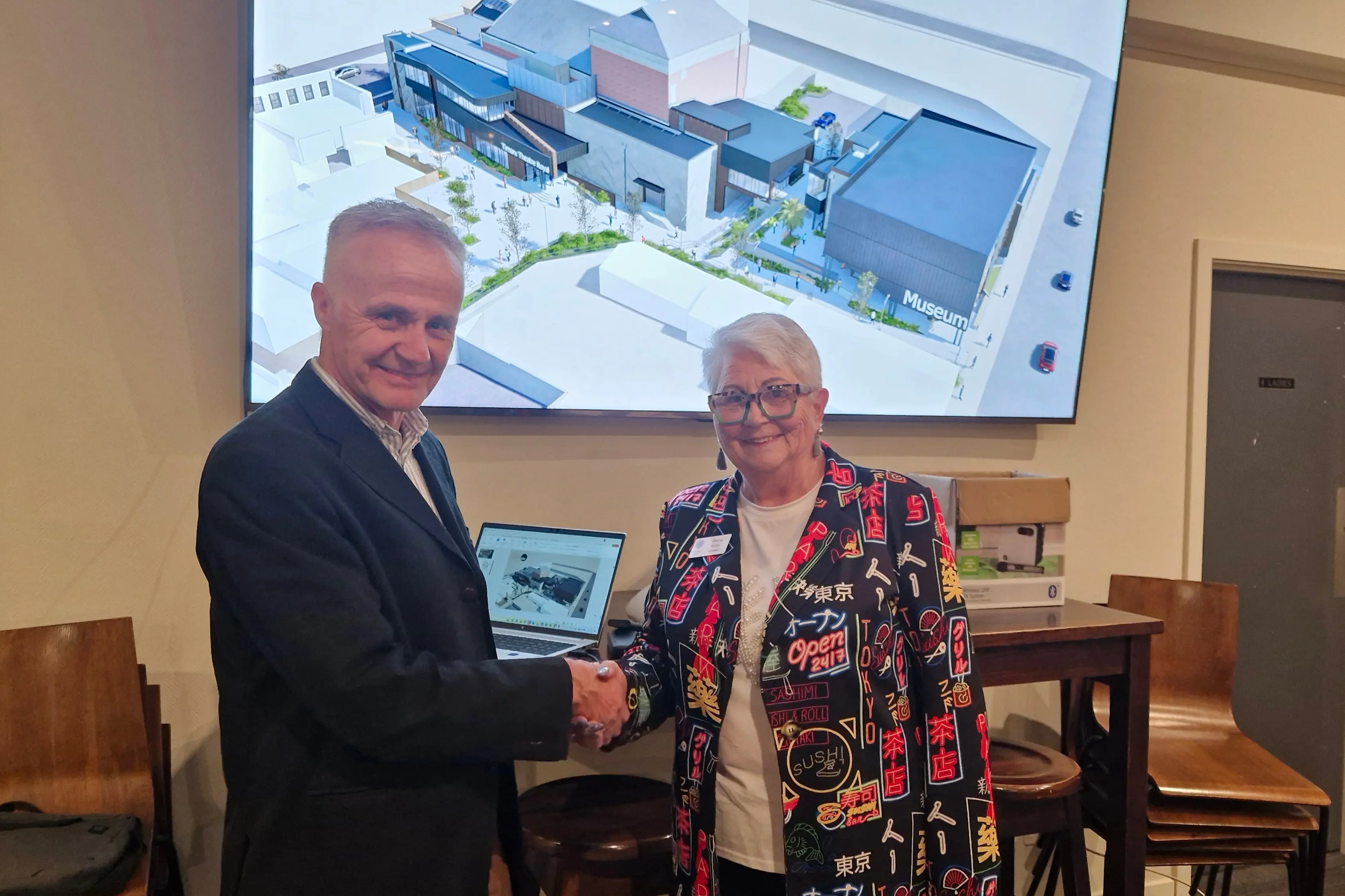 Museum director Philip Howe accepts the donation from Timaru Host Lions Club president Paula Knife. Photo: Supplied