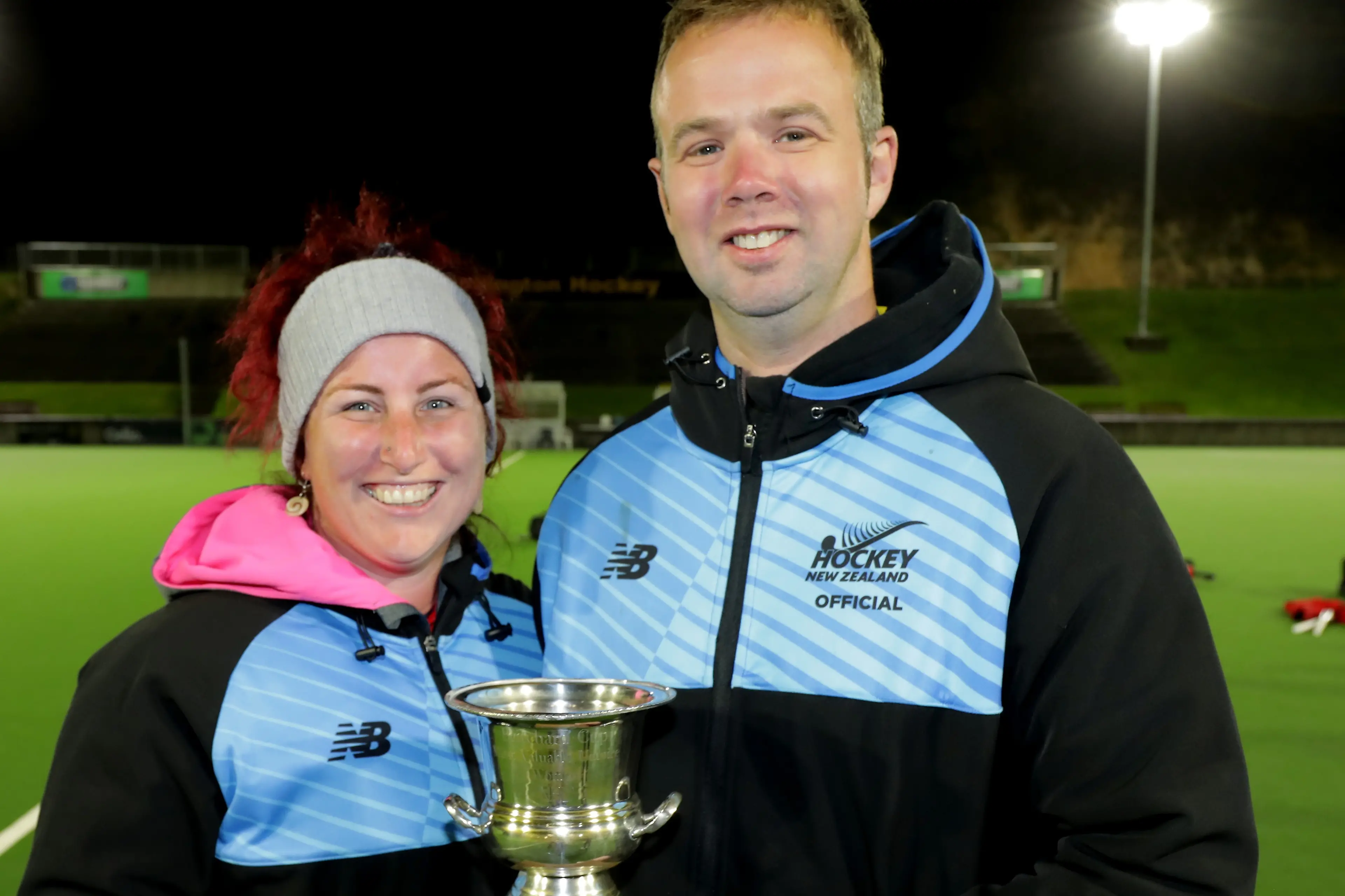 Hockey Southland umpire Emma Bromell holds the most valuable female official trophy she won at the national championship recently. Wellington\\'s Stephen McLachlan who won the best male official stands beside her. Photo: BW Media