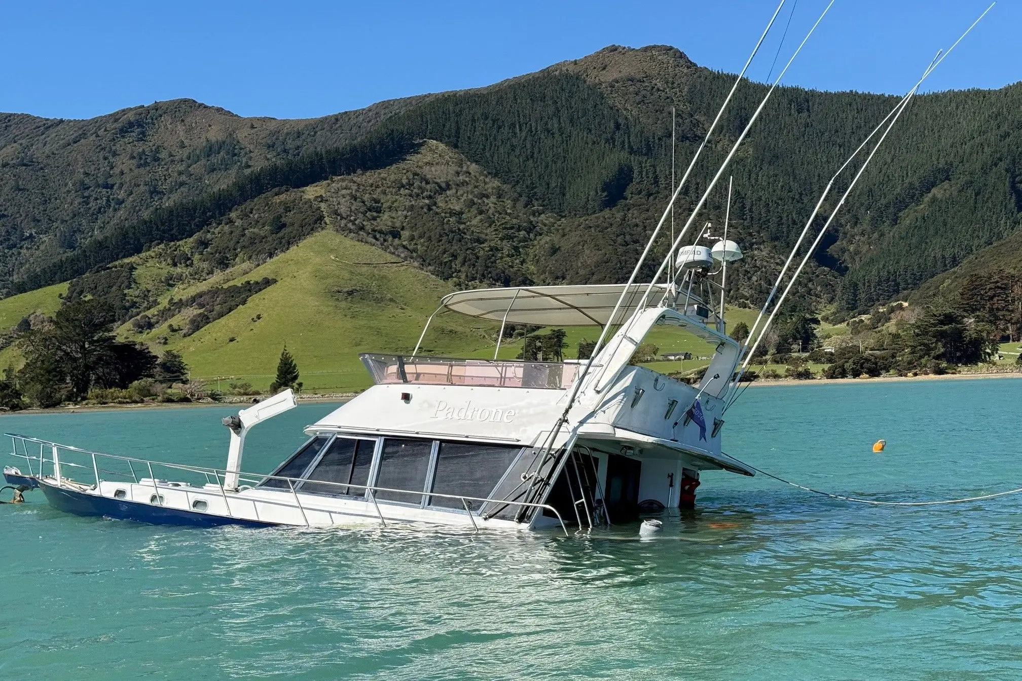 The Padrone is partly submerged near Waitaria Bay jetty in the Marlborough Sounds. Photo: Supplied.