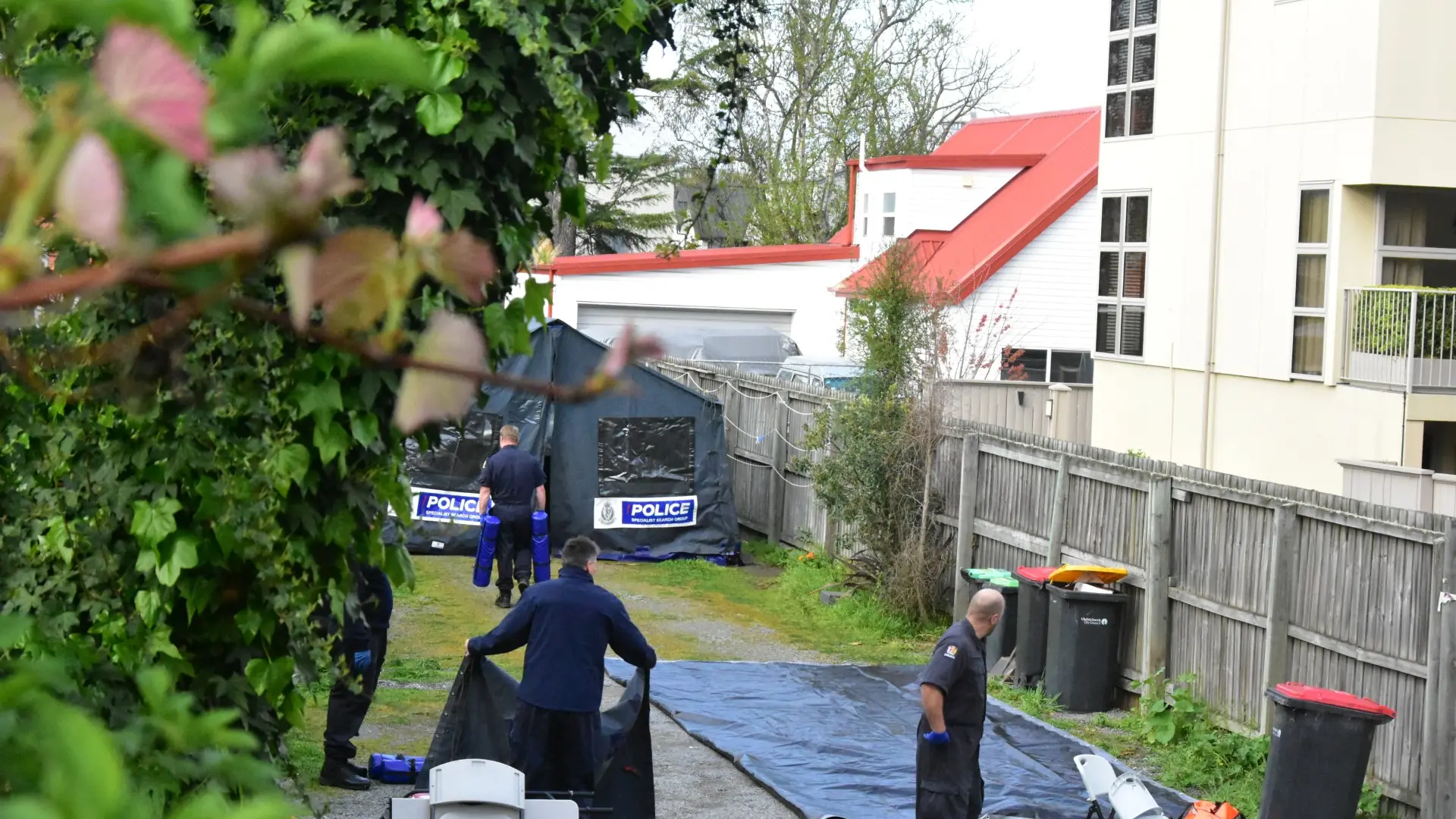 Neighbours heard ‘loud bangs’ before woman was found dead