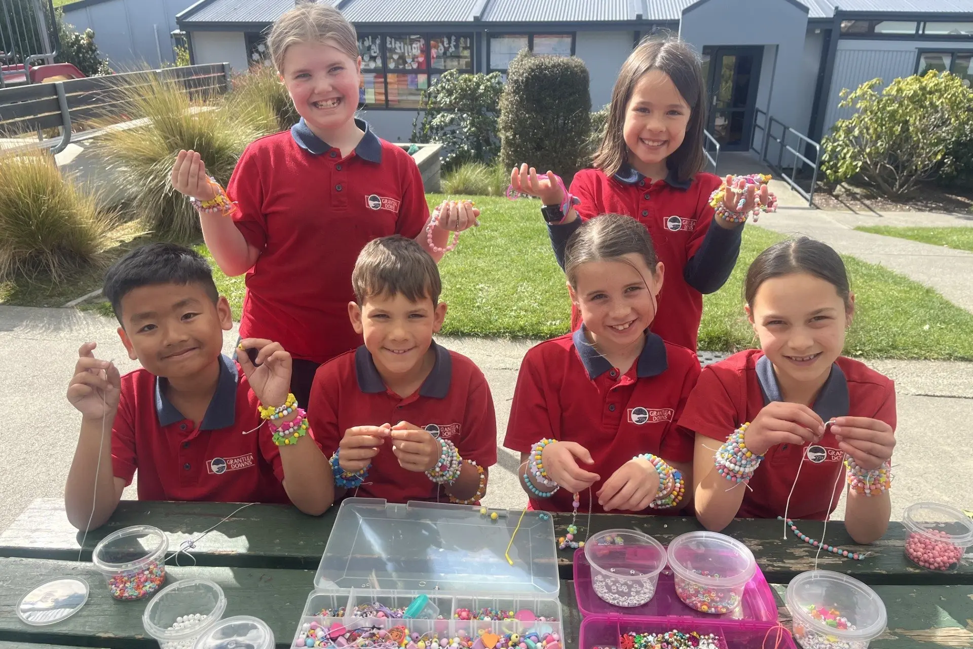 Busy creating bracelets for an upcoming gala day are Grantlea Downs students (back, from left) Sophia Kirk, 8, Sophia Leslie, 8, and (front, from left) Klay Cariaga, 8, Chase Reweti, 8, Bella Ford, 9, and Te Aika Reihana, 8. Photo: Supplied