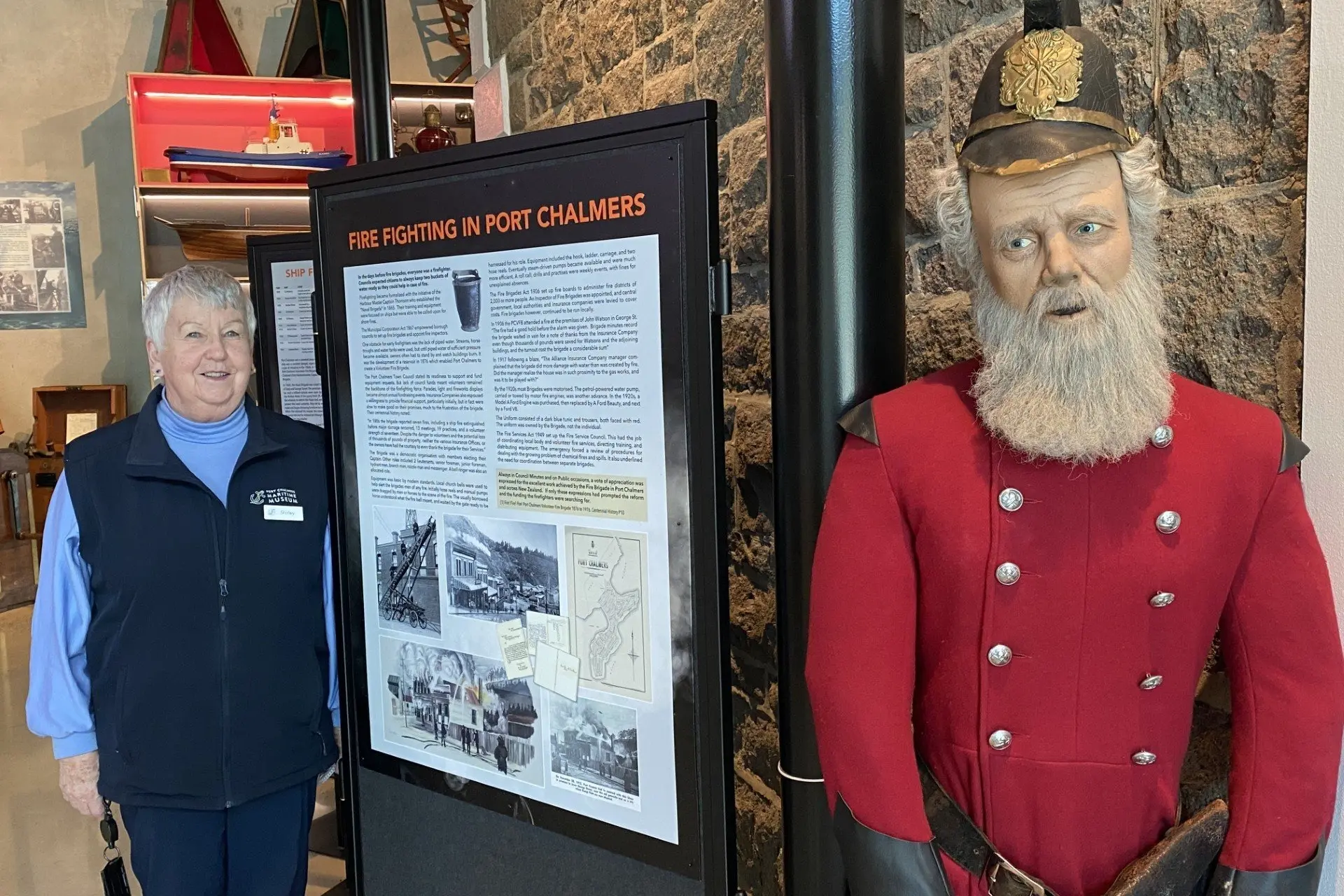Port Chalmers Historical Society president Shirley Jack stands with the exhibition she has curated on the history of Port Chalmers Volunteer Fire Brigade, which has opened at Port Chalmers Maritime Museum this week. Photo: Brenda Harwood