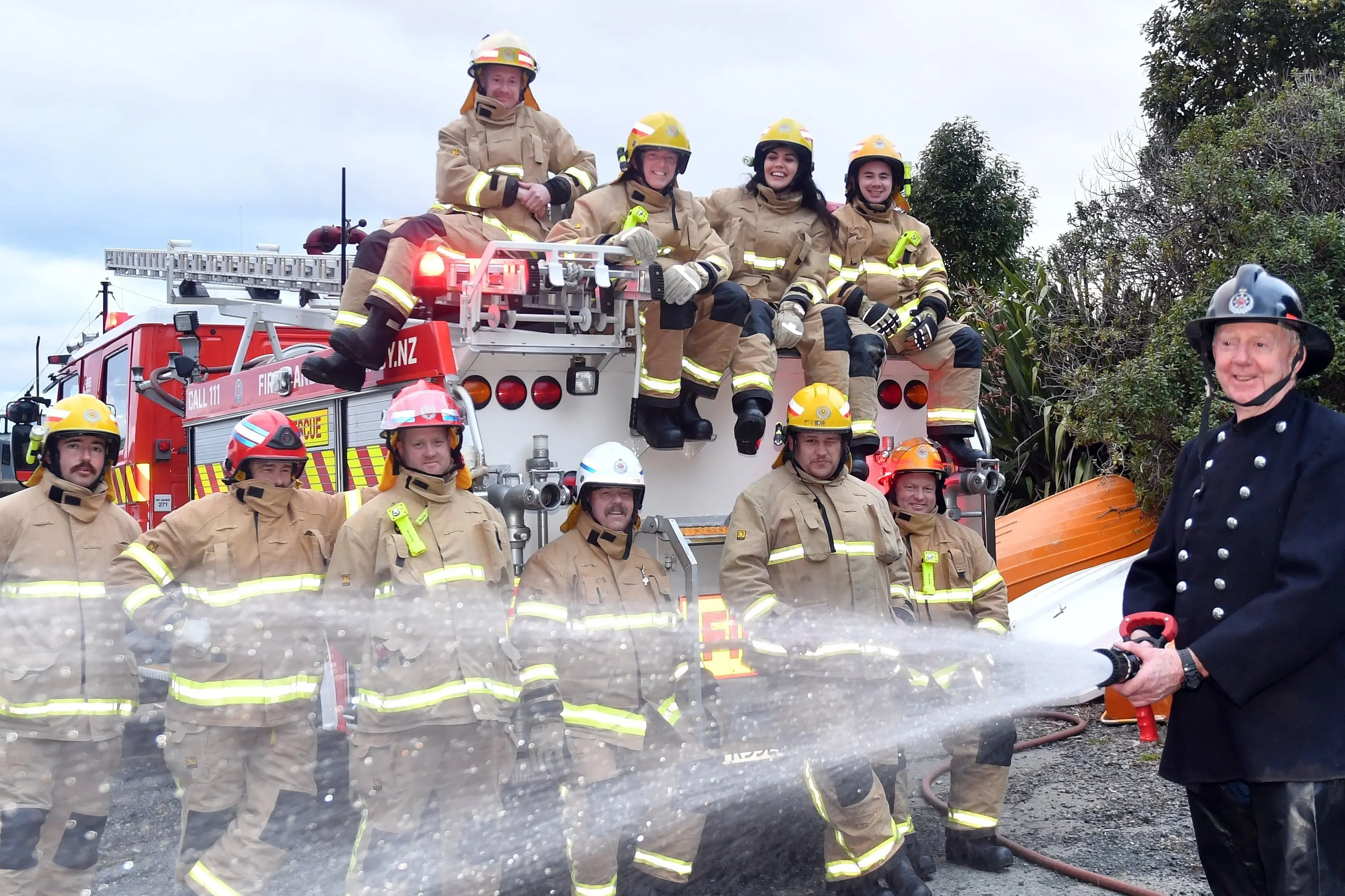 Celebrating the Port Chalmers Fire Brigade\\'s 150th anniversary are the current batch of volunteer firefighters (top, from left) JK Burnett, Jon Visser, Caroline Hall, Sam Sam Mitchel-Gin (fromt, from left) Mark McIver, Ant O\\u2019Neill, Will Hall, Cory White, Mitchell Porter-Thomas, Adam Smith and chief fire officer Stephen Hill in an original 1976 firefighting uniform. Photo: Stephen Jaquiery