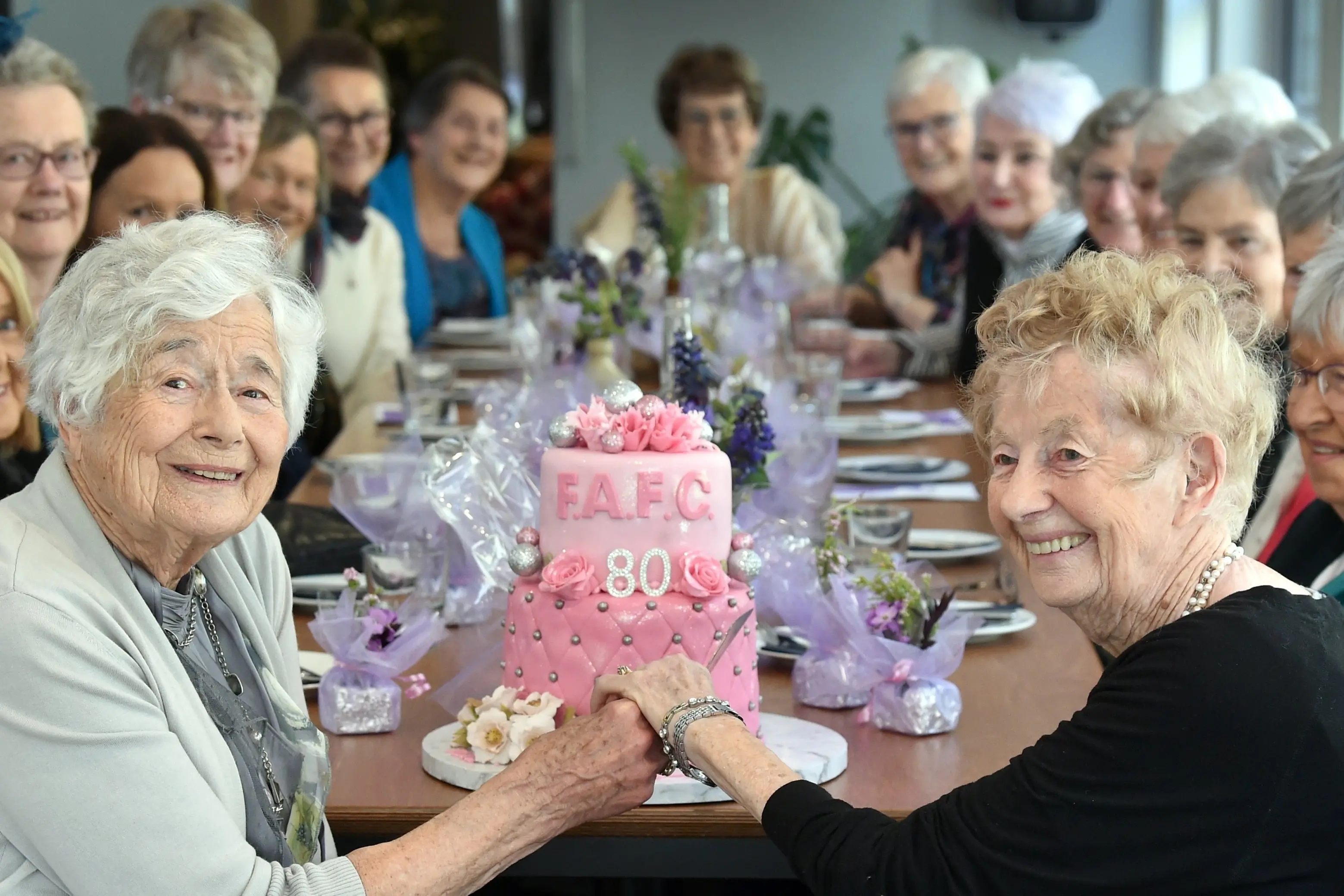Joan Leslie, 90 (left), and Evelyn Walters, 95, celebrate the 80th anniversary of the Floral Art Friendship Club with others at Glenfalloch Woodland Gardens on Wednesday. Photo: Peter McIntosh