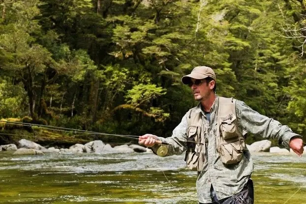NZ Professional Fishing Guides Association president Dean Bell doing what he does best, on a backcountry river in the South. Photo: Supplied