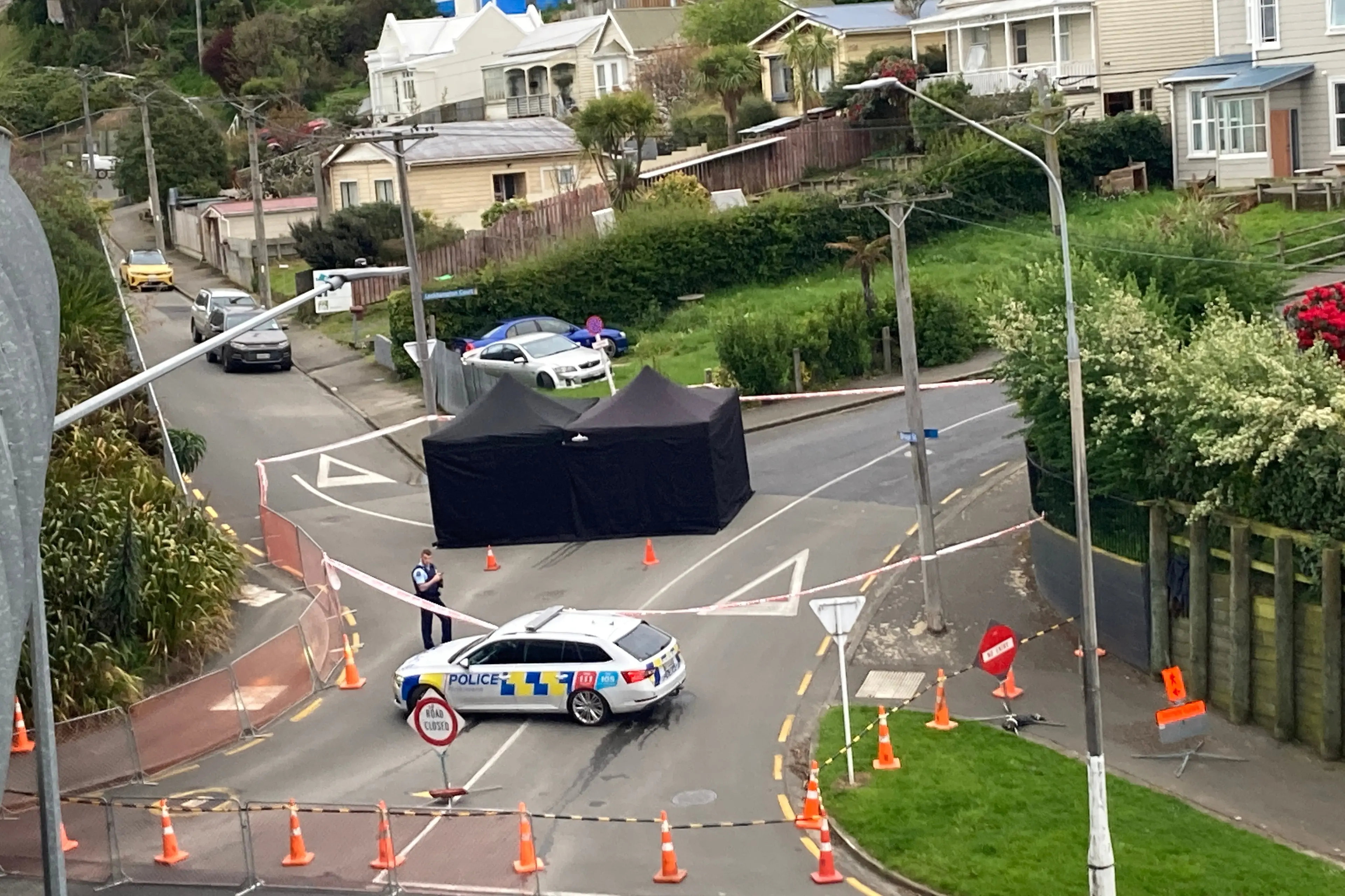 A police officer at the scene on Thursday morning. Photo: Stephen Jaquiery