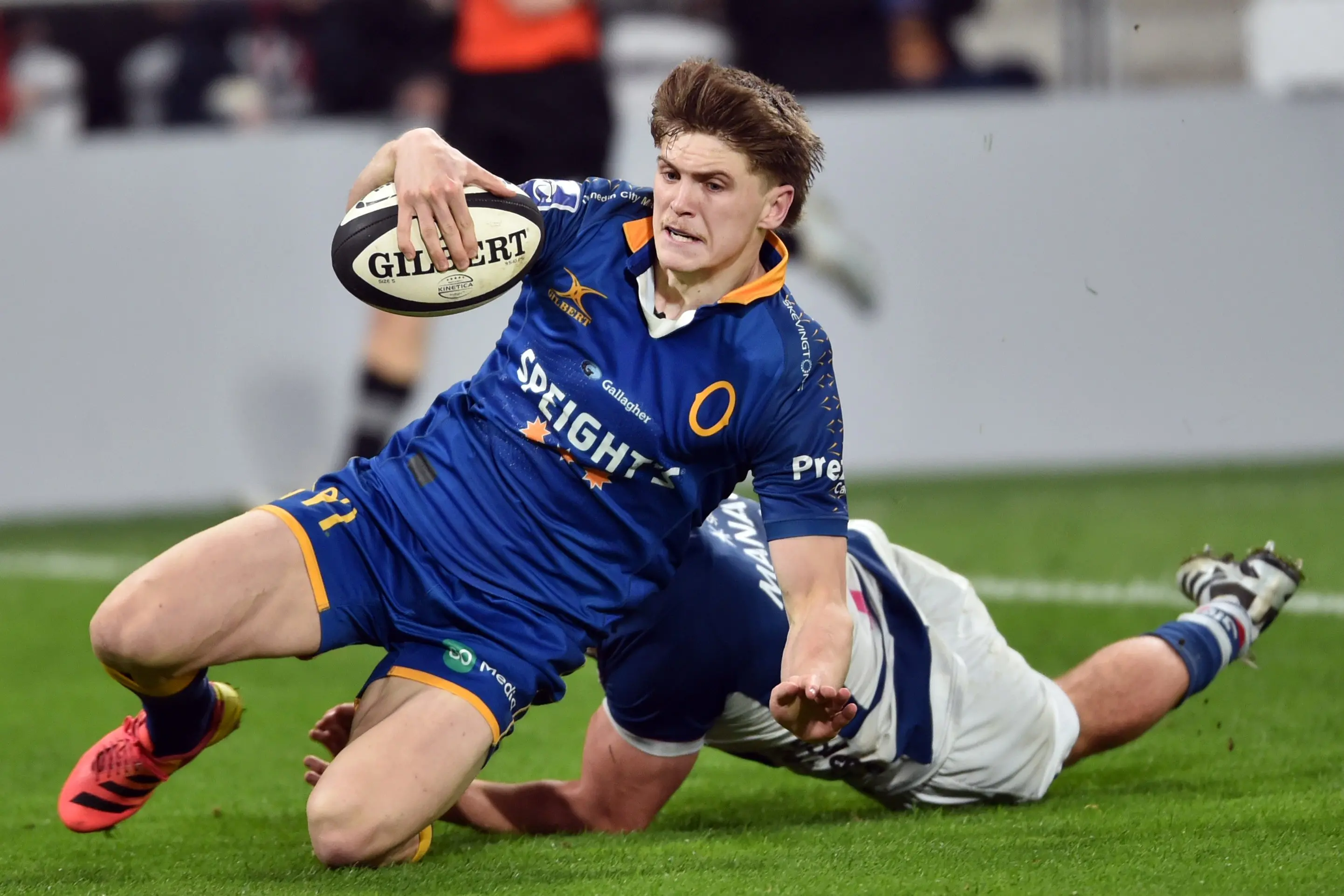 Otago fullback Sam Nemec-Vial gets passed Auckland flanker Caleb Woodley to score a try during their NPC match against Auckland at Forsyth Barr Stadium on Thursday night. Photo: Peter McIntosh