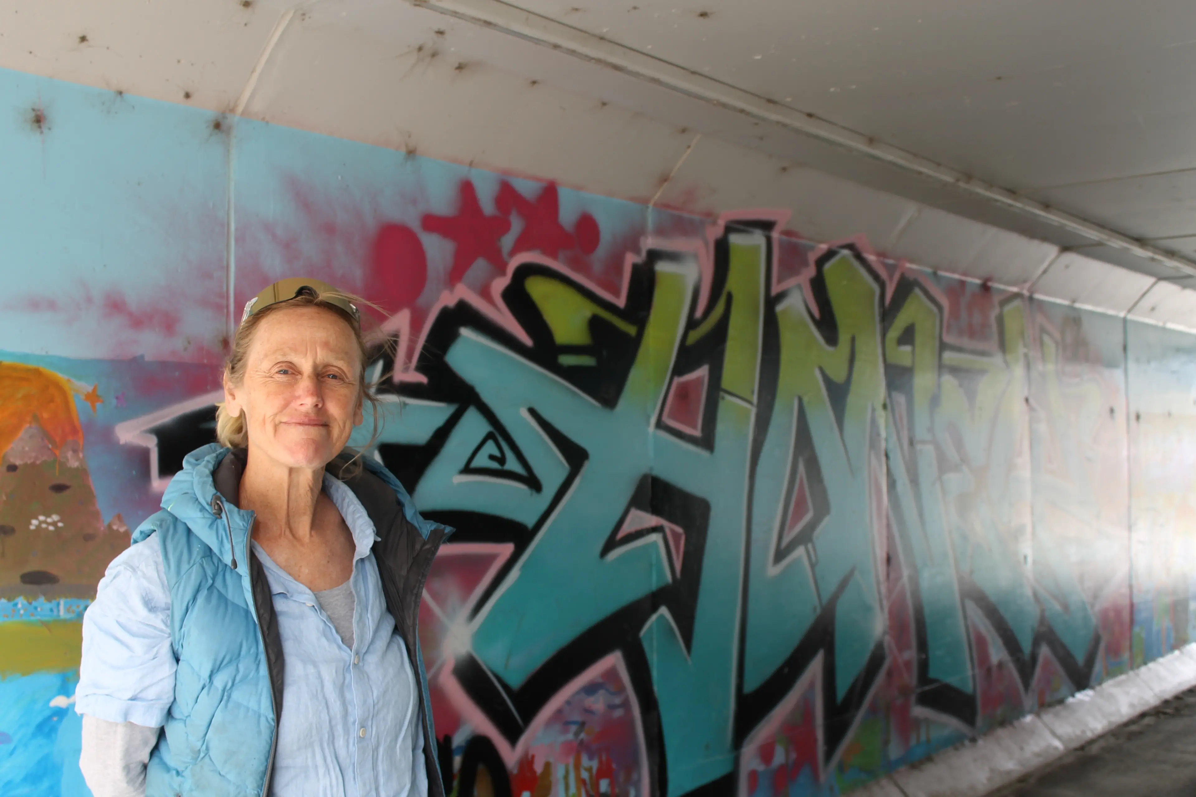 \"Great art, wrong place\" is the message local artist Chrissy Wickes has for the person who painted a large tag over an art mural created by school children. Photo: Evie Sinclair