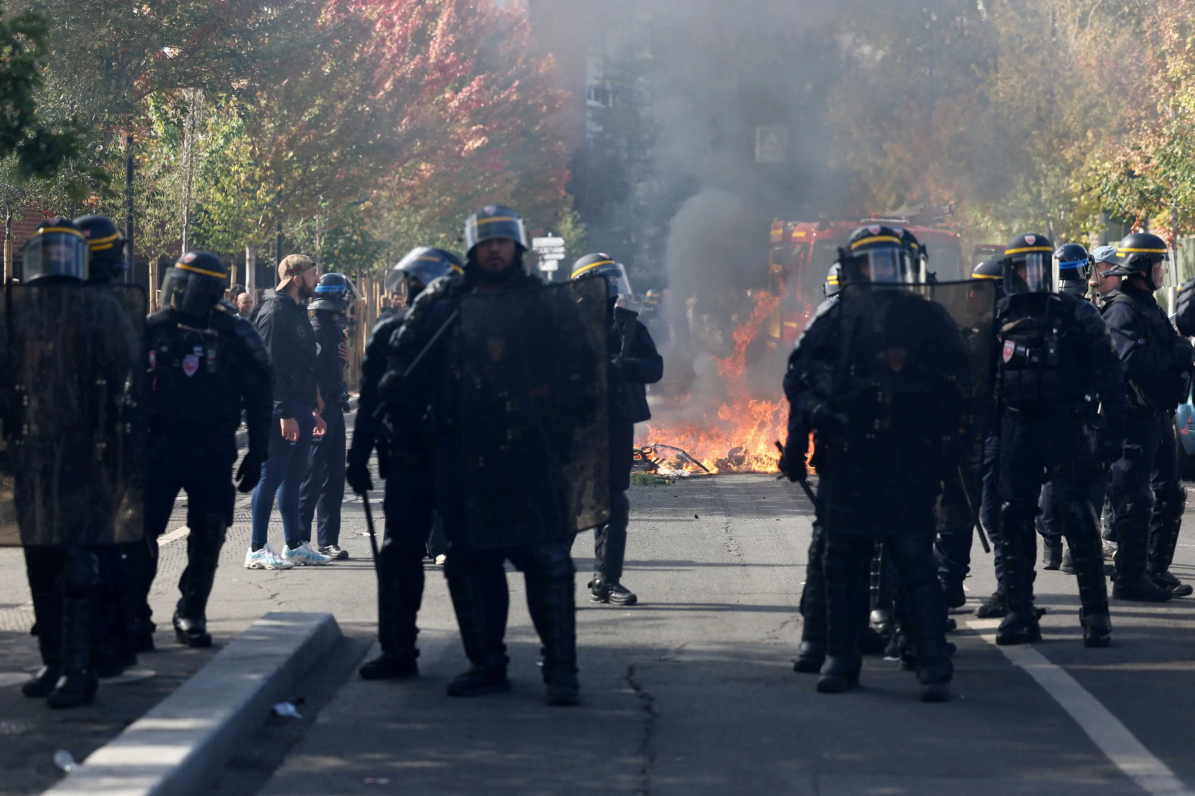 French riot police stand in position amid clashes during a protest by French students in Saint-Denis. Photo: Reuters