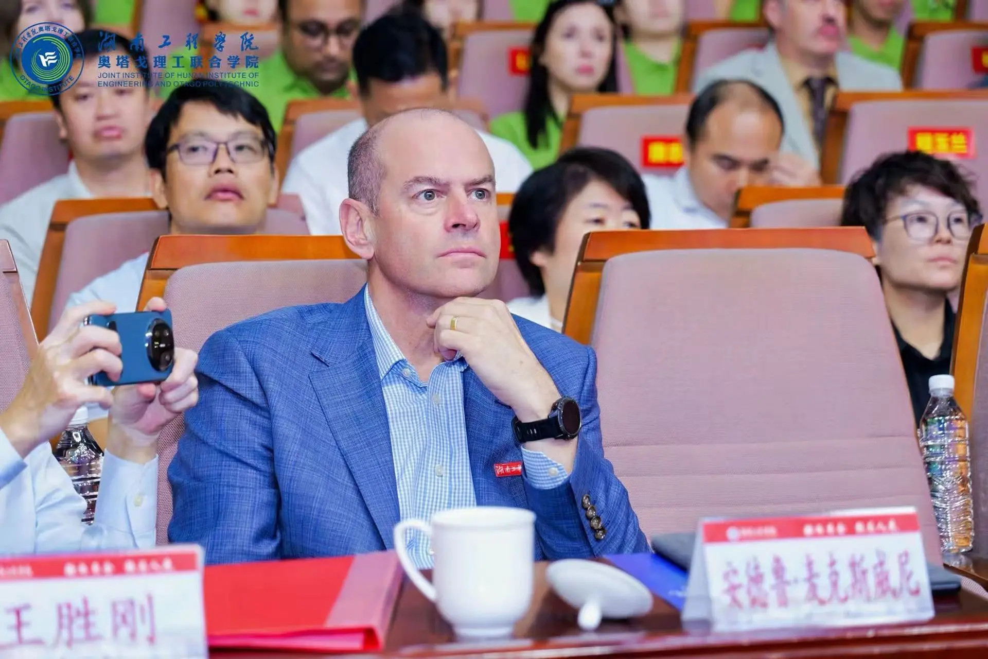 Otago Polytechnic chief executive Andrew McSweeney listens to presentations during the welcome ceremony for the first students at Otago Institute in Xiangtan.