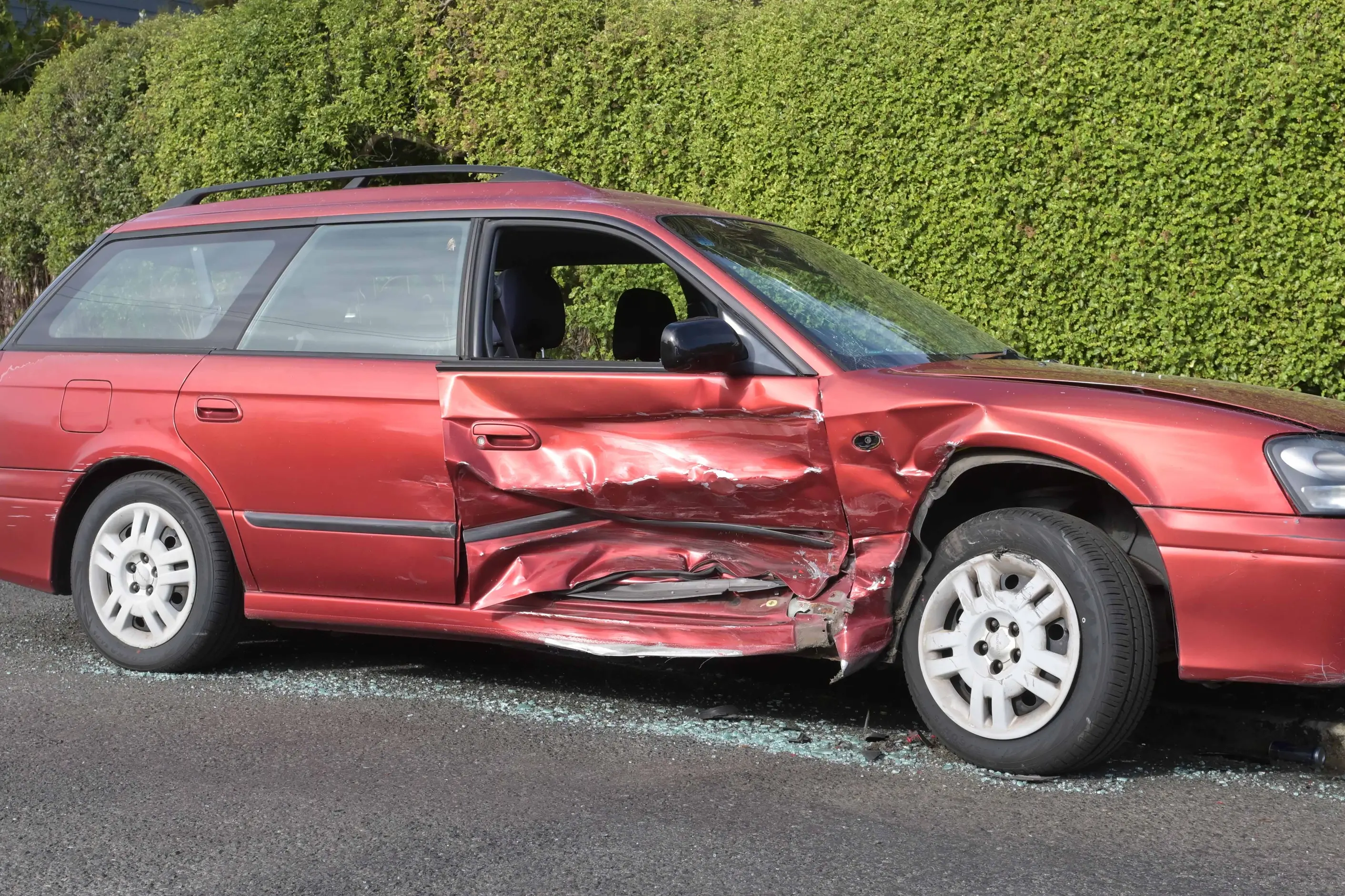 A badly damaged Subaru wagon, in Maitland St, after being hit by another car on Saturday morning. Photo: Gerard O\\'Brien