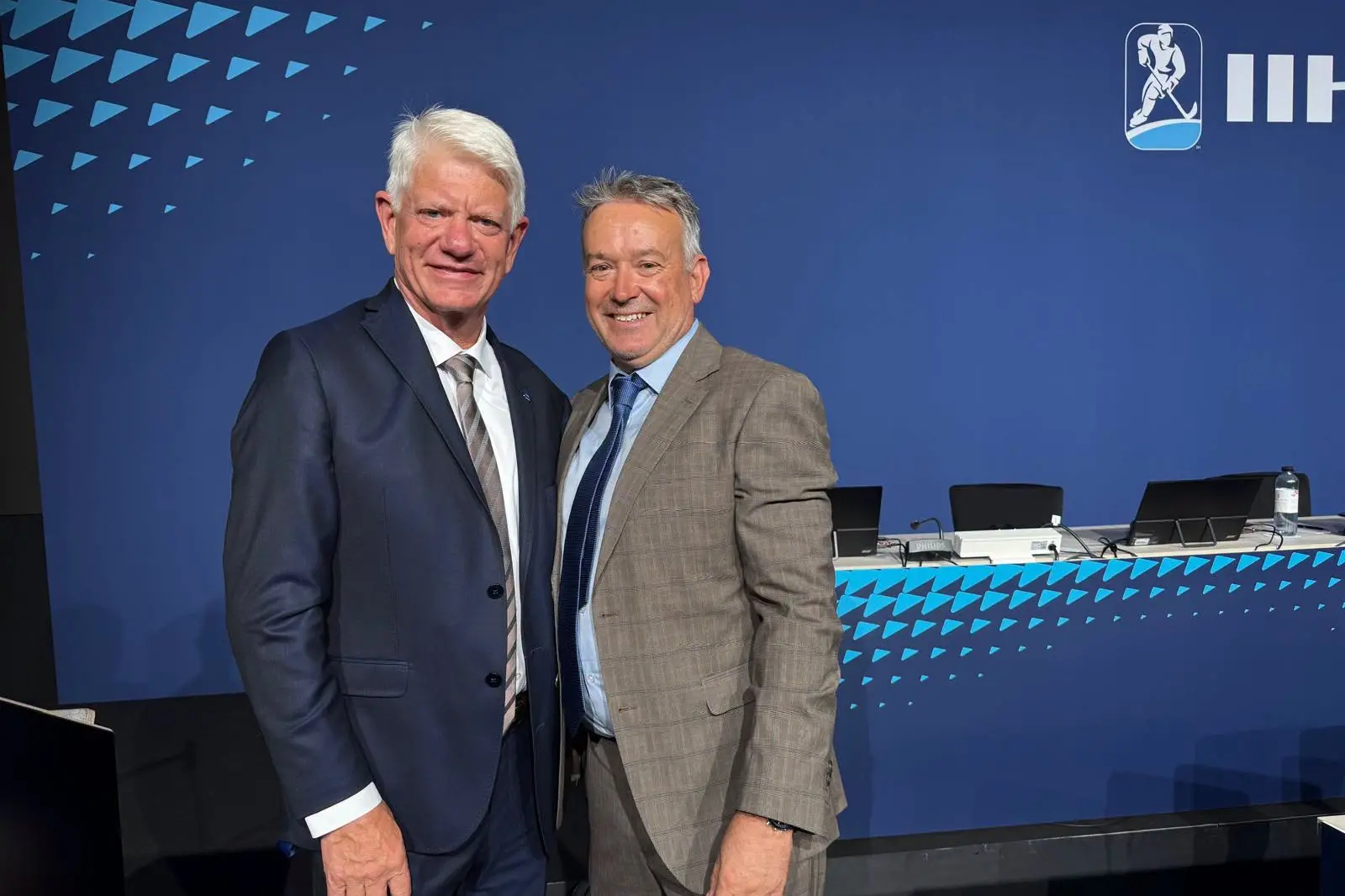 Andy Mills (right) with new world ice hockey president Franz Reindl. Photo: Supplied