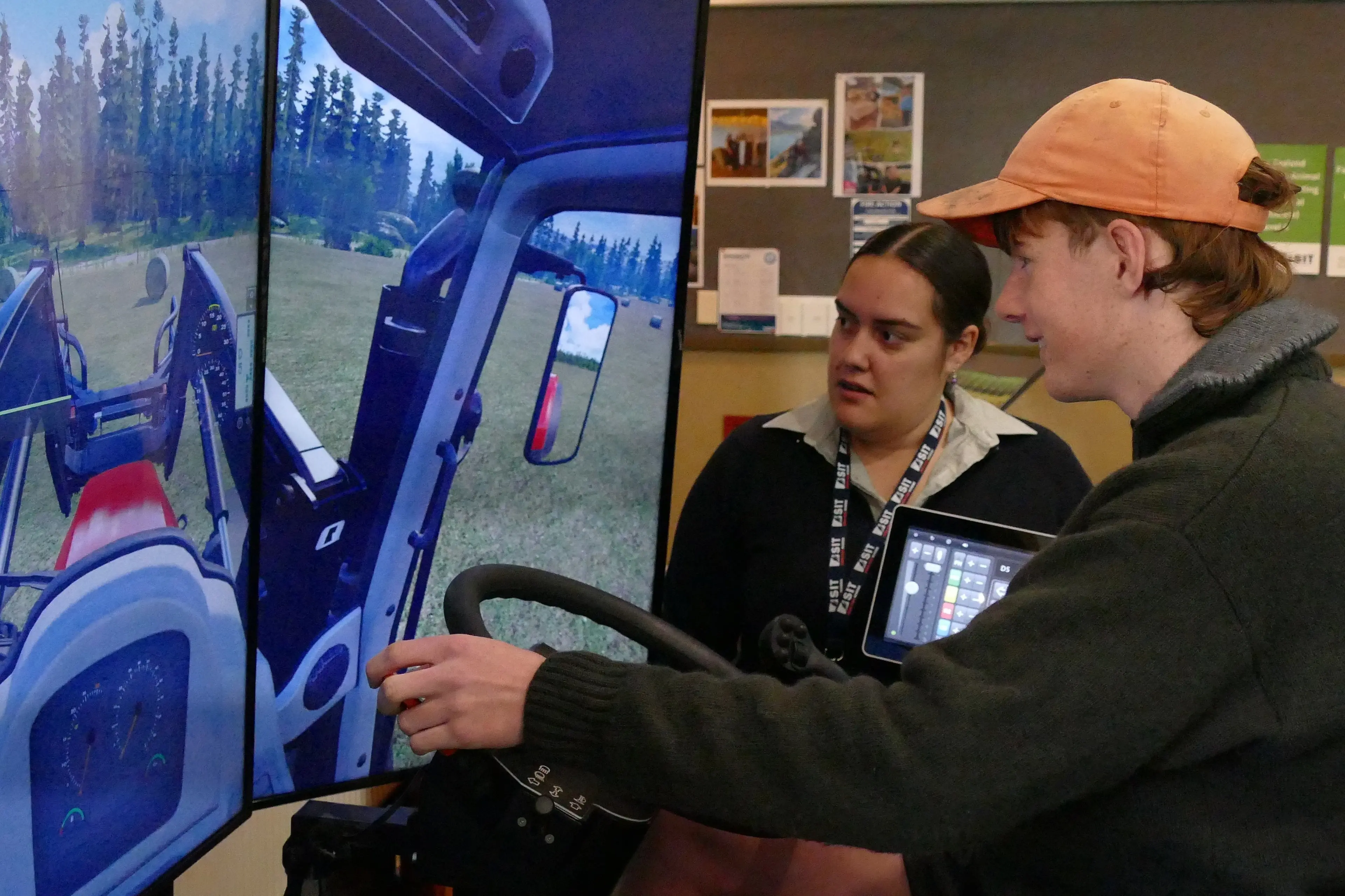 Telford marketing officer Billie-Marie Henry shows Dunedin student Bradley Tapp, 16, how to use the SIT farm institute\\u2019s tractor simulator during an open day last year. The campus roll continues to grow following recent government investment. Photo: Richard Davison