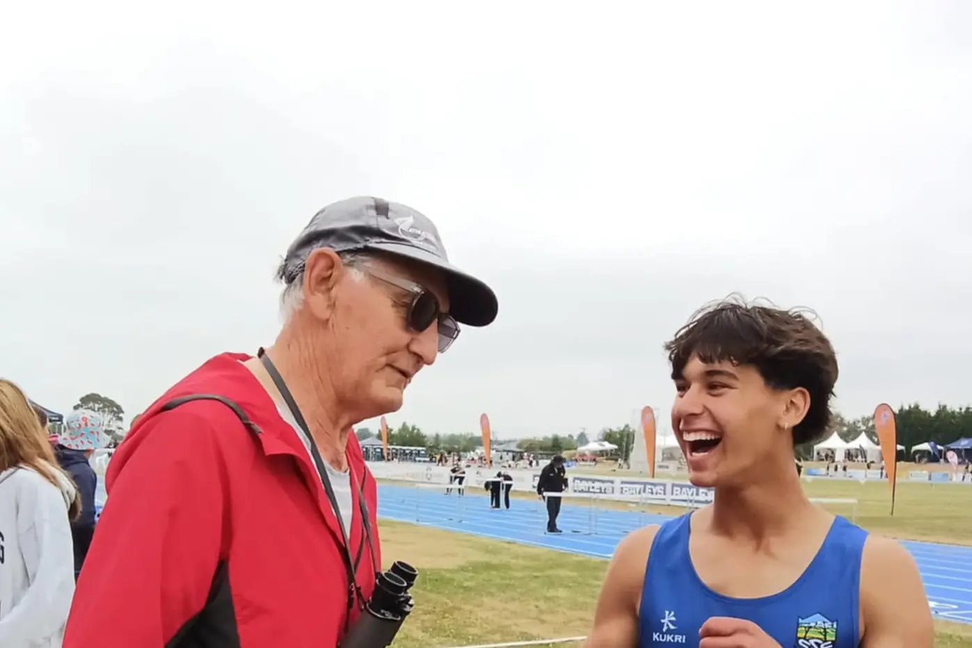 Invercargill athletics coach lance Smith offers some words of encouragement to his protege hurdler Connor Gilliland, then 17,  at an event last year. Photo: Supplied