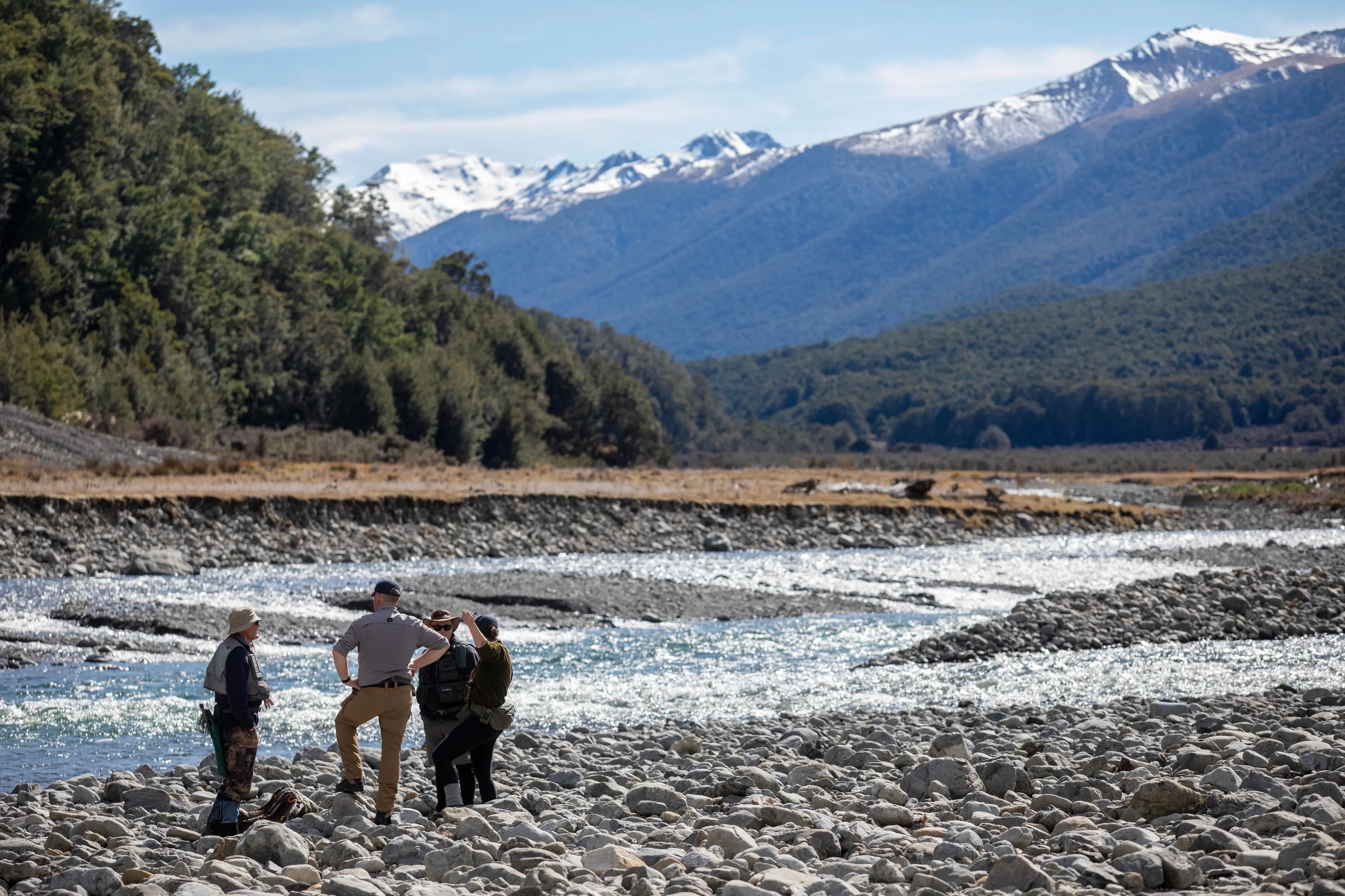 River Crossing . . . North Canterbury Fish & Game Field Officer Emily Craig & Fish & Game New Zealand Chief Operating Officer Richie Cosgrove cross the Boyle River in the Lewis Pass Designated Waters Fishery on the opening day of the 2026/27 season. Photo: Jackson Meecham//North Canterbury Fish & Game