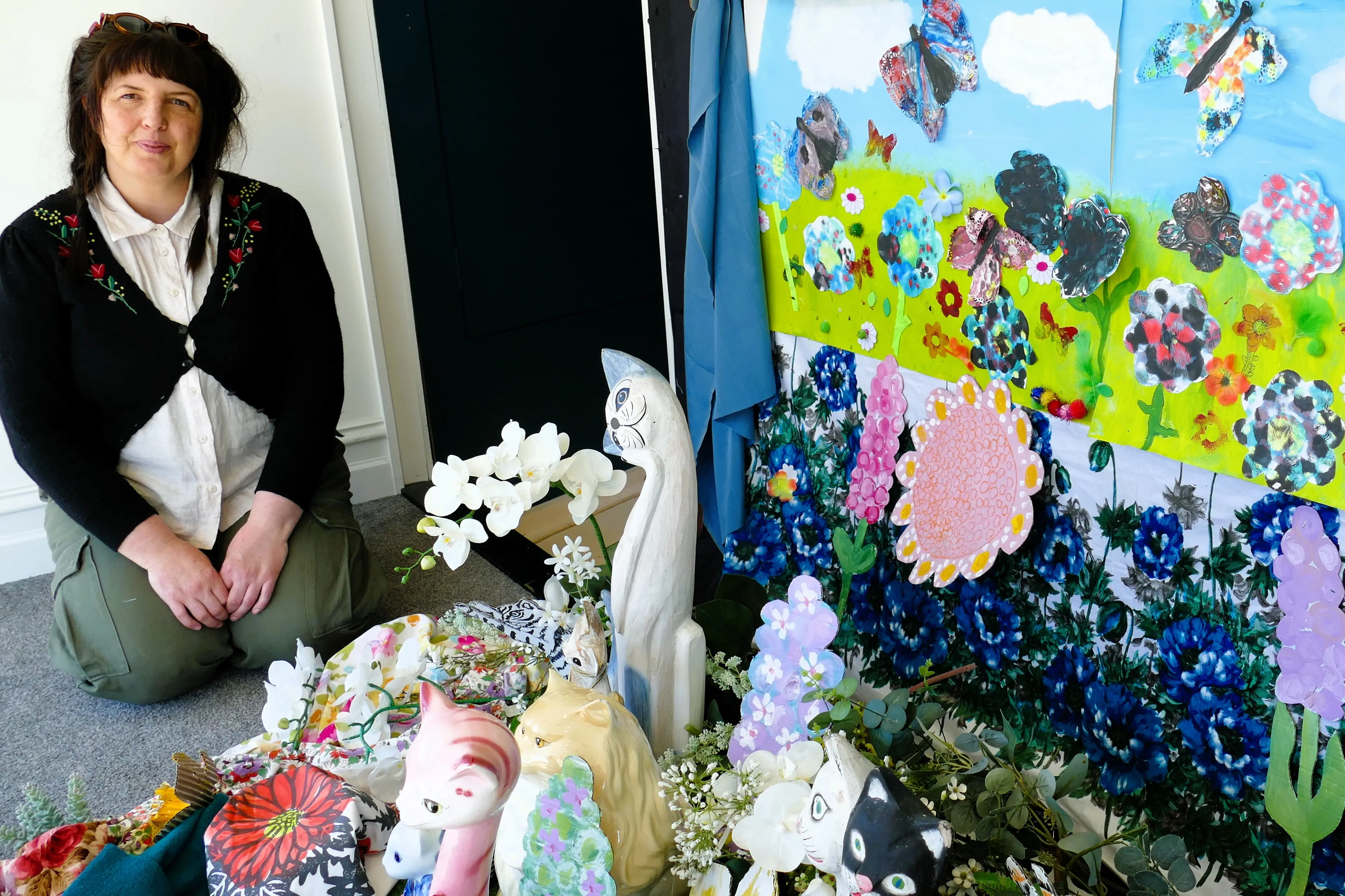 Lawrence Creative Arts community arts facilitator Rachel Taylor inspects the Clutha Cats art exhibition display at The Junction on the town\\'s Ross Place, last week. Photo: Richard Davison