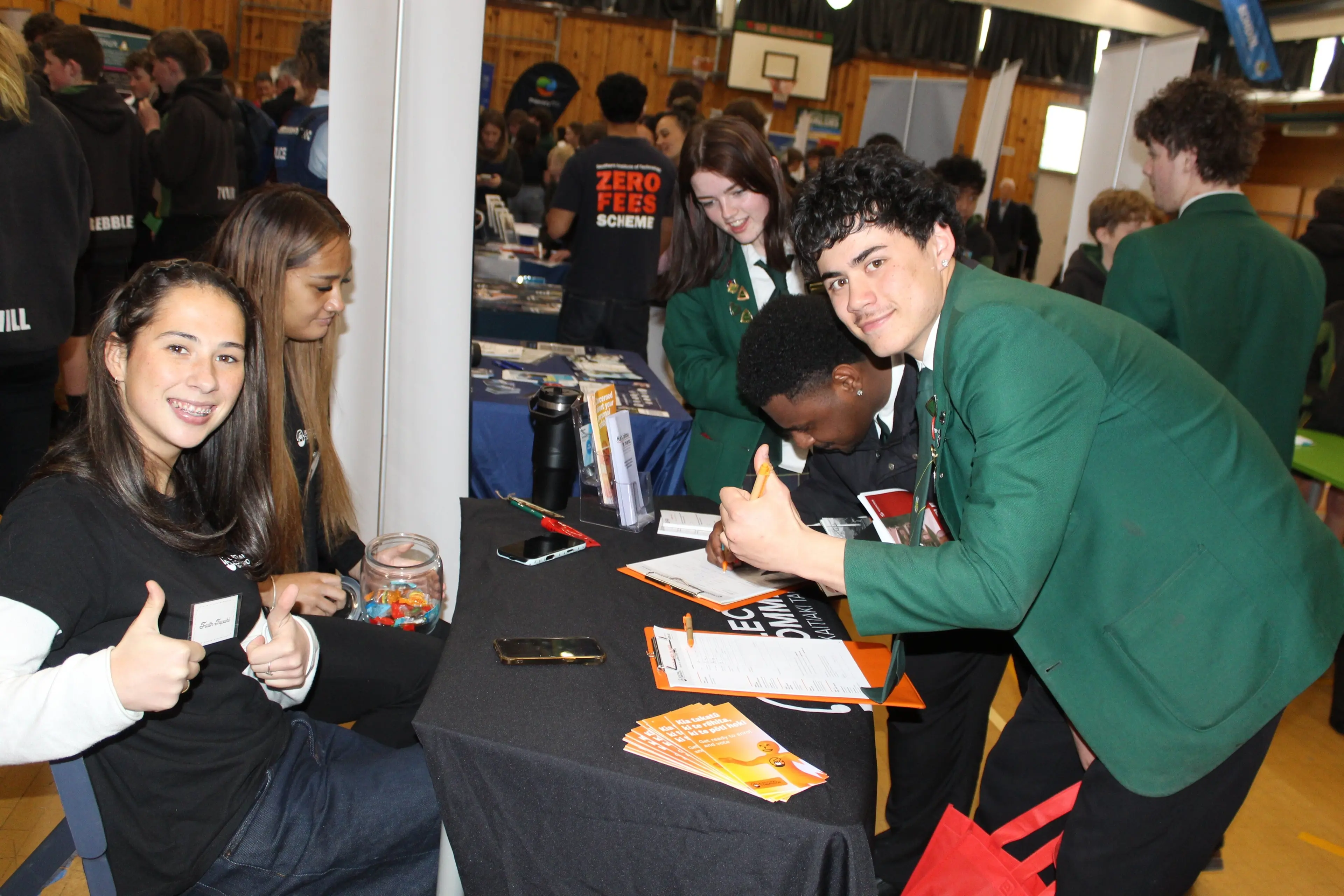 East Otago High School students enrol to vote at the Electoral Commission\\'s stall at the school\\'s careers expo. Photo: supplied