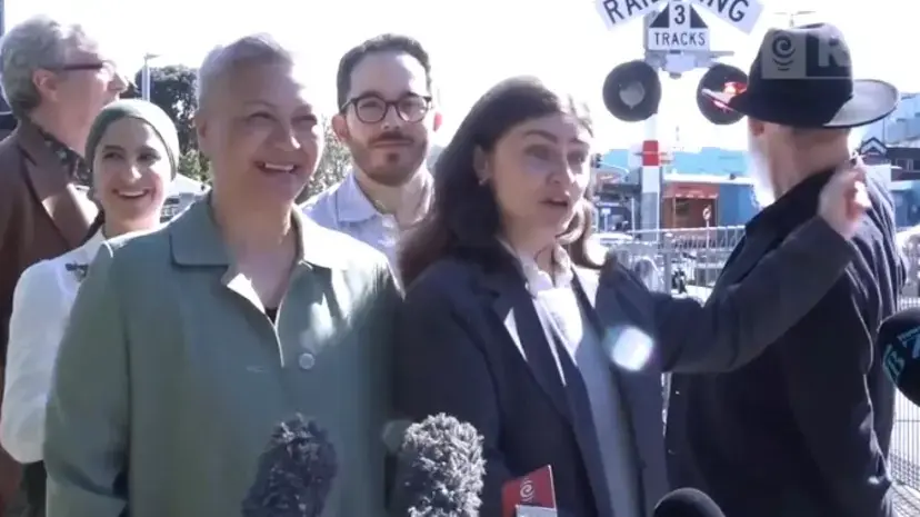 Near-miss with train interrupts Greens' level crossing announcement