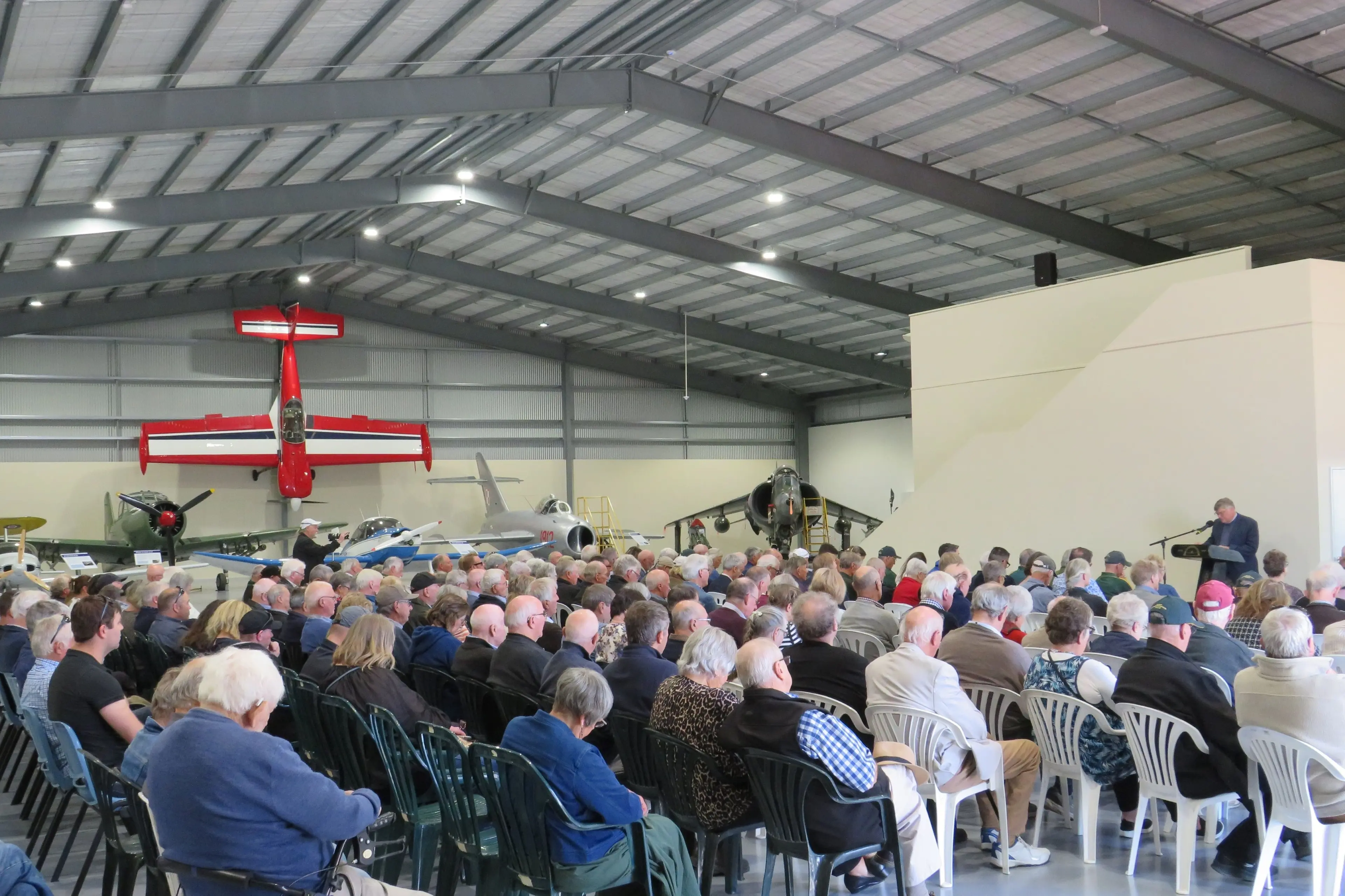Dr Richard Waugh addresses the crowd at the Ashburton Aviation Museum\\'s official opening of the Heslerton Hangar. Photo: Toni Williams
