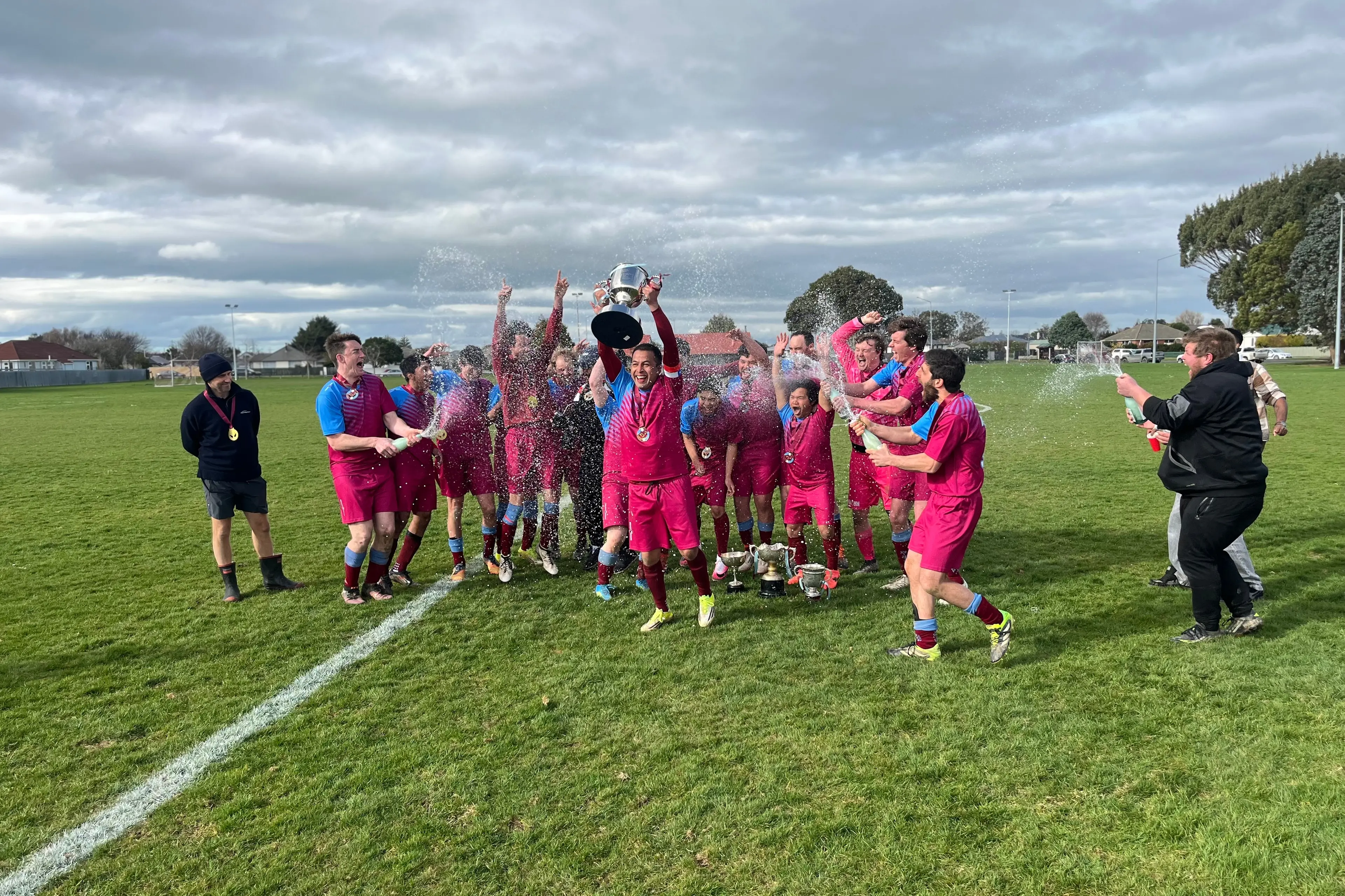 Captain Miguel Ortiz and his team celebrate winning the Donald Gray Cup. The Winton Football senior men\\u2019s team, alongside the coaching staff, celebrated an unforgettable season. The club finished the year holding all four Southland Premier League trophies. Photo: supplied