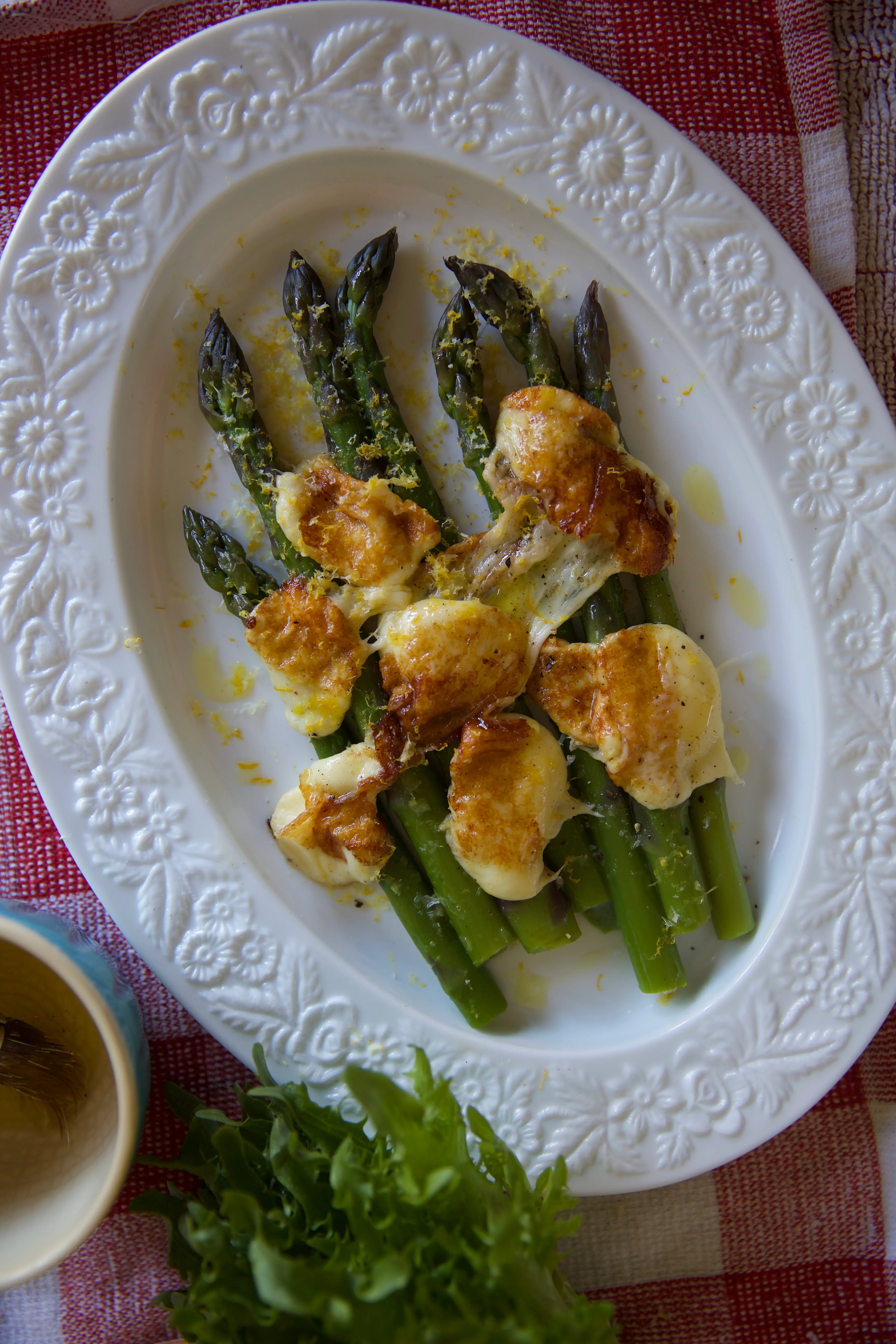Grilled asparagus, melted curds and frozen lemon