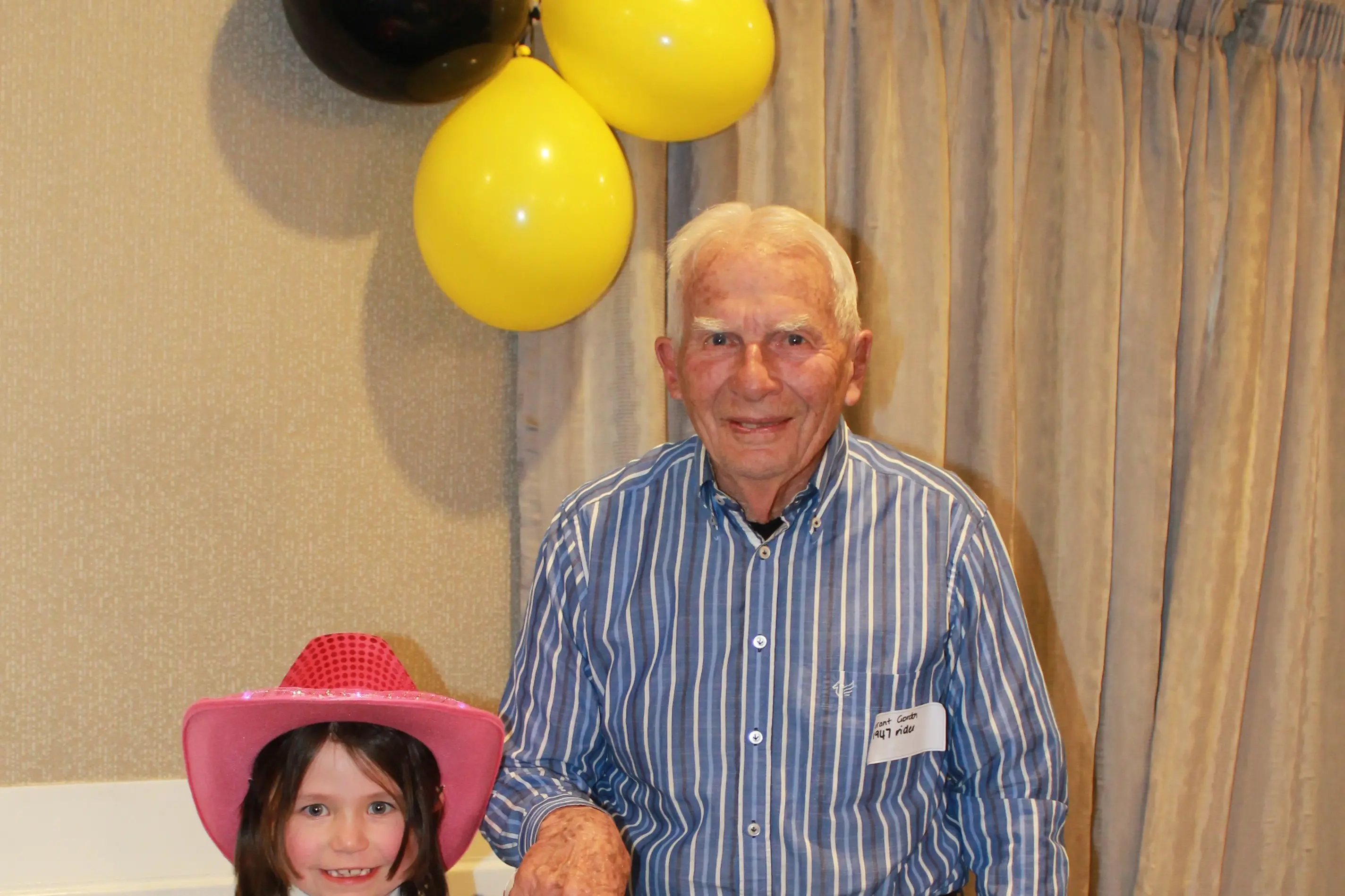 Jasmine McEwan who was the youngest at the Invercargill Kennington Pony Club 75th anniversary celebration and Grant Gordon, the oldest cut the anniversary cake. Photo: Supplied