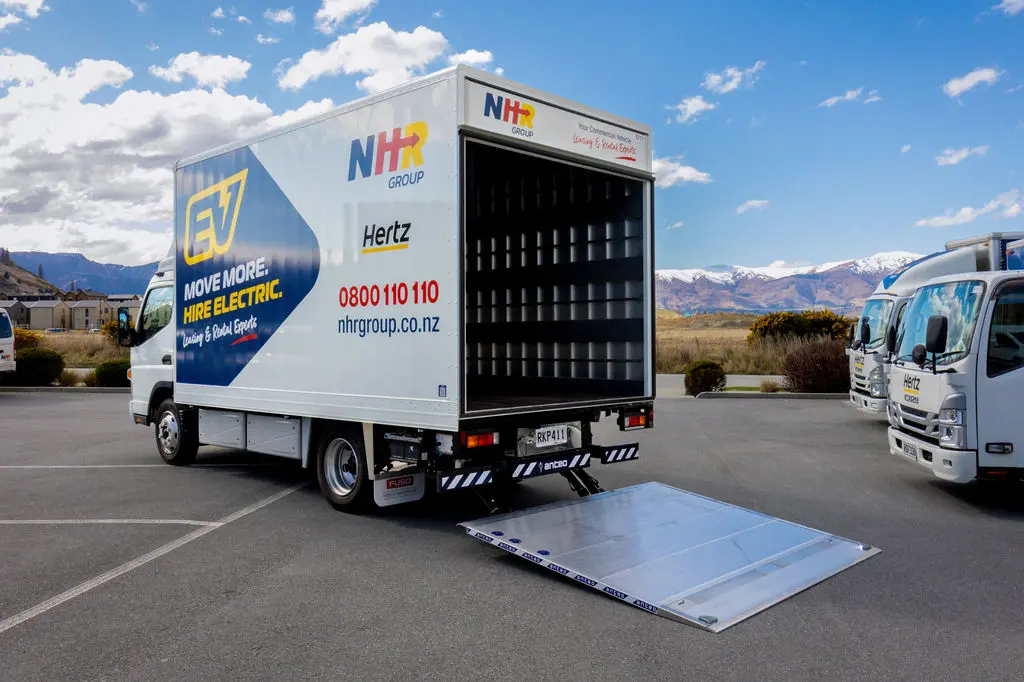 Clean, green moving machine: NHR Group\\'s just introduced this Mitsubishi Fuso eCanter - the first electric moving truck in the Queenstown-Lakes - to its new Frankton branch. Photo: Still Vision Photography