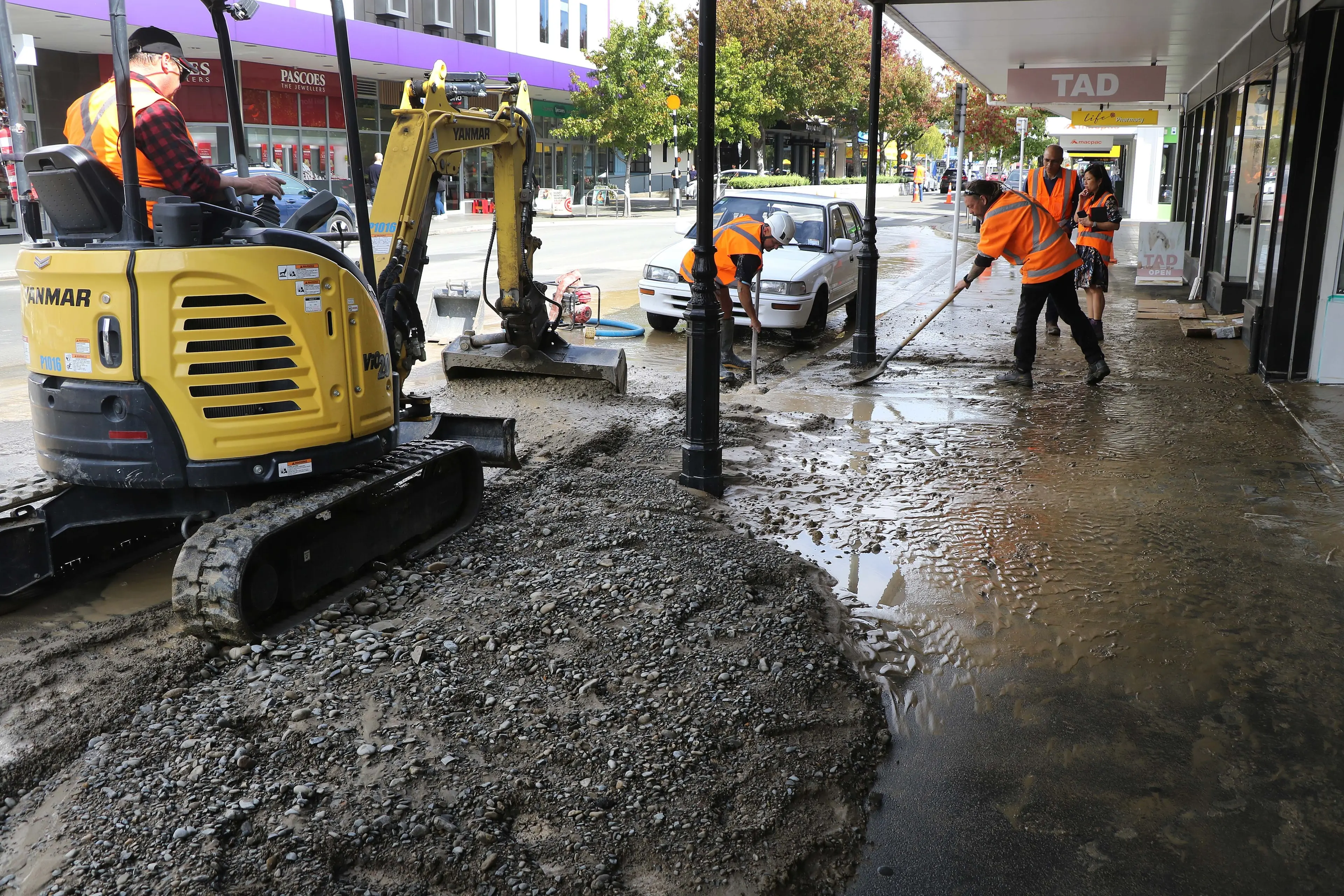 Flooding . . . Waimakariri District Council waters team staff busy with the clean up following a burst water pipe in High Street, Rangiora, in March 2025. Photo: File