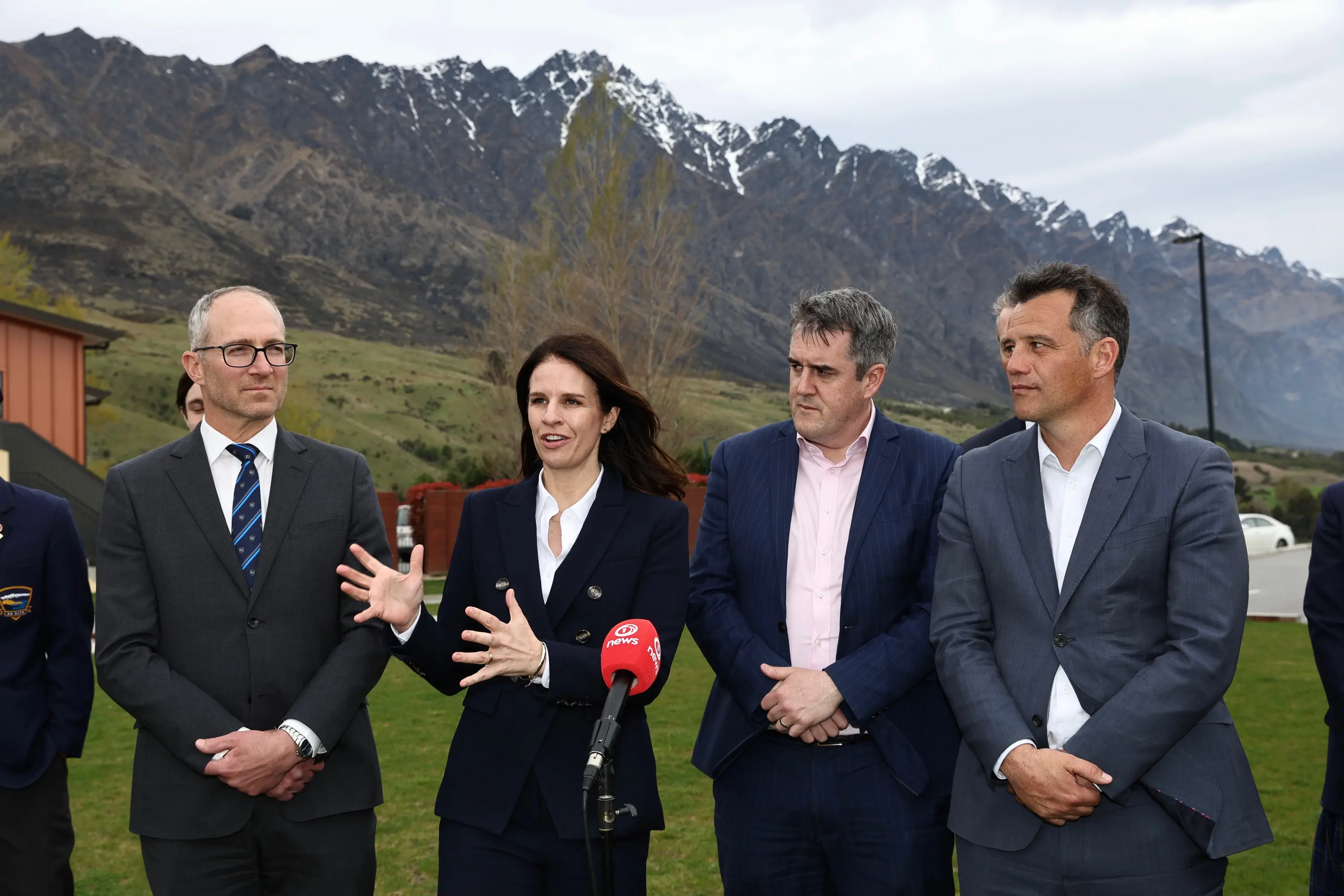 Responding to demand: Watched by, from left, principal Oded Nathan, Infrastructure Minister Chris Bishop and local MP Joseph Mooney, Education Minister Erica Stanford announces Wakatipu High will be provided\\u00A0another\\u00A012 classrooms on this site, east of the current school, by 2028. Photo: James Allan Photography