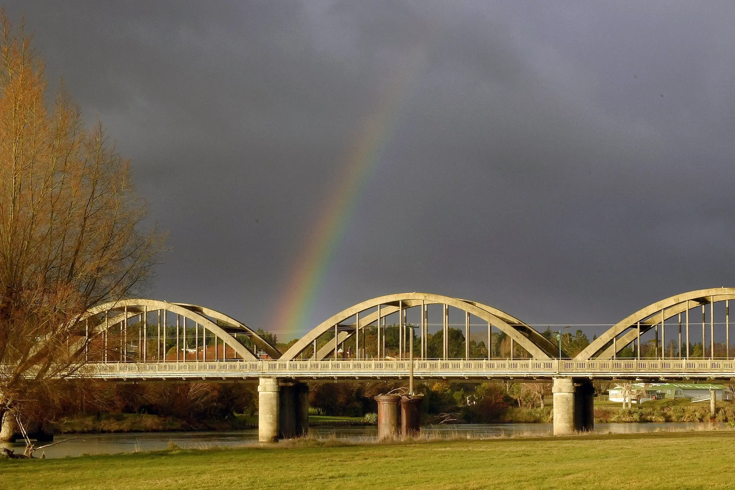 Sunshine defeats the rain once more in Balclutha, as a rainbow graces the town\\'s hallmark bridge across the Clutha River. Photo: Stephen Jaquiery