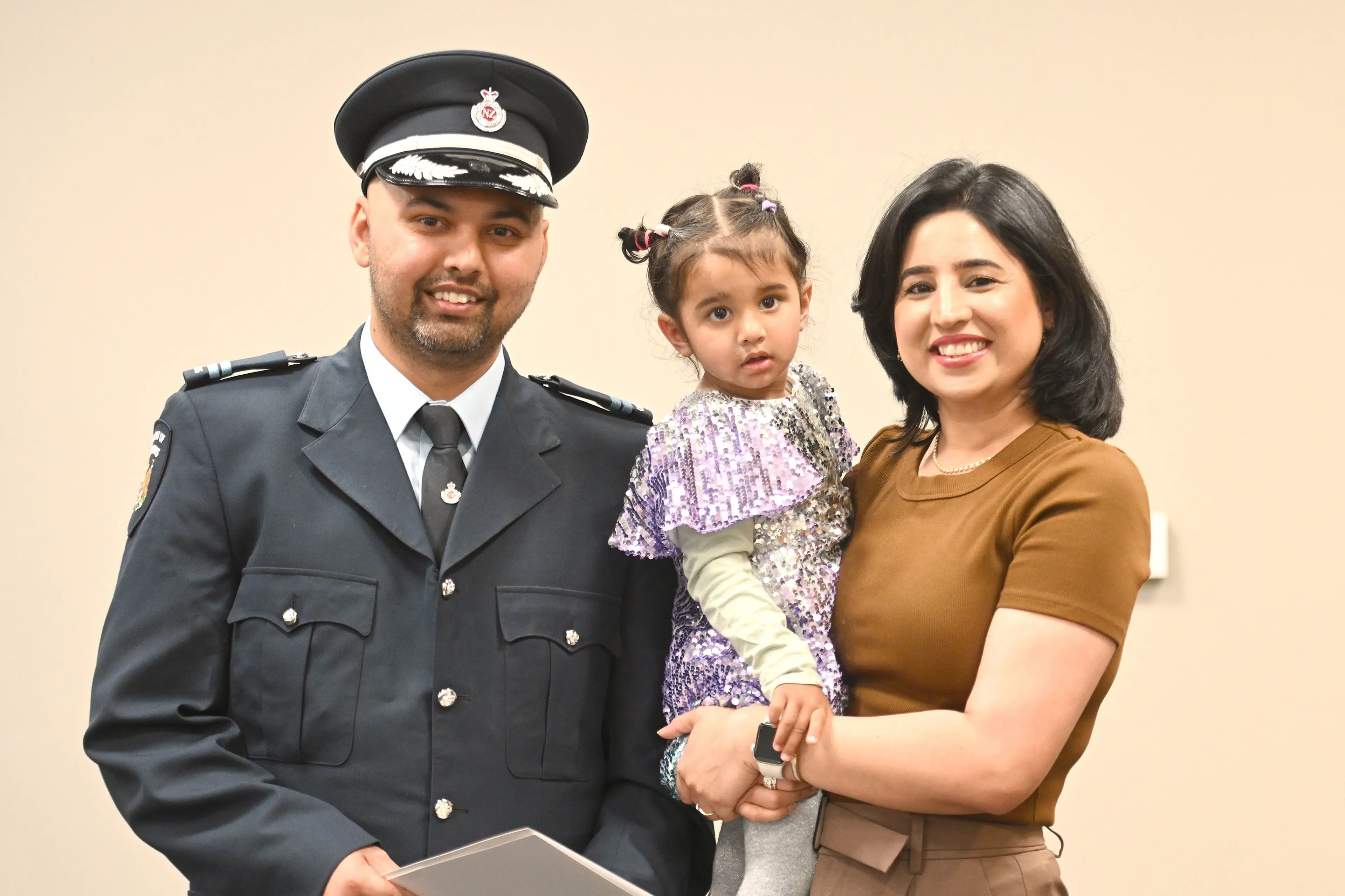 Savraj Singh, of Punjab, India celebrates his New Zealand citizenship with wife Jashan Kaur and daughter Jasnoor Randhawa, 2, at a citizenship ceremony in the Dunedin Town Hall on Wednesday. Photo: Linda Robertson