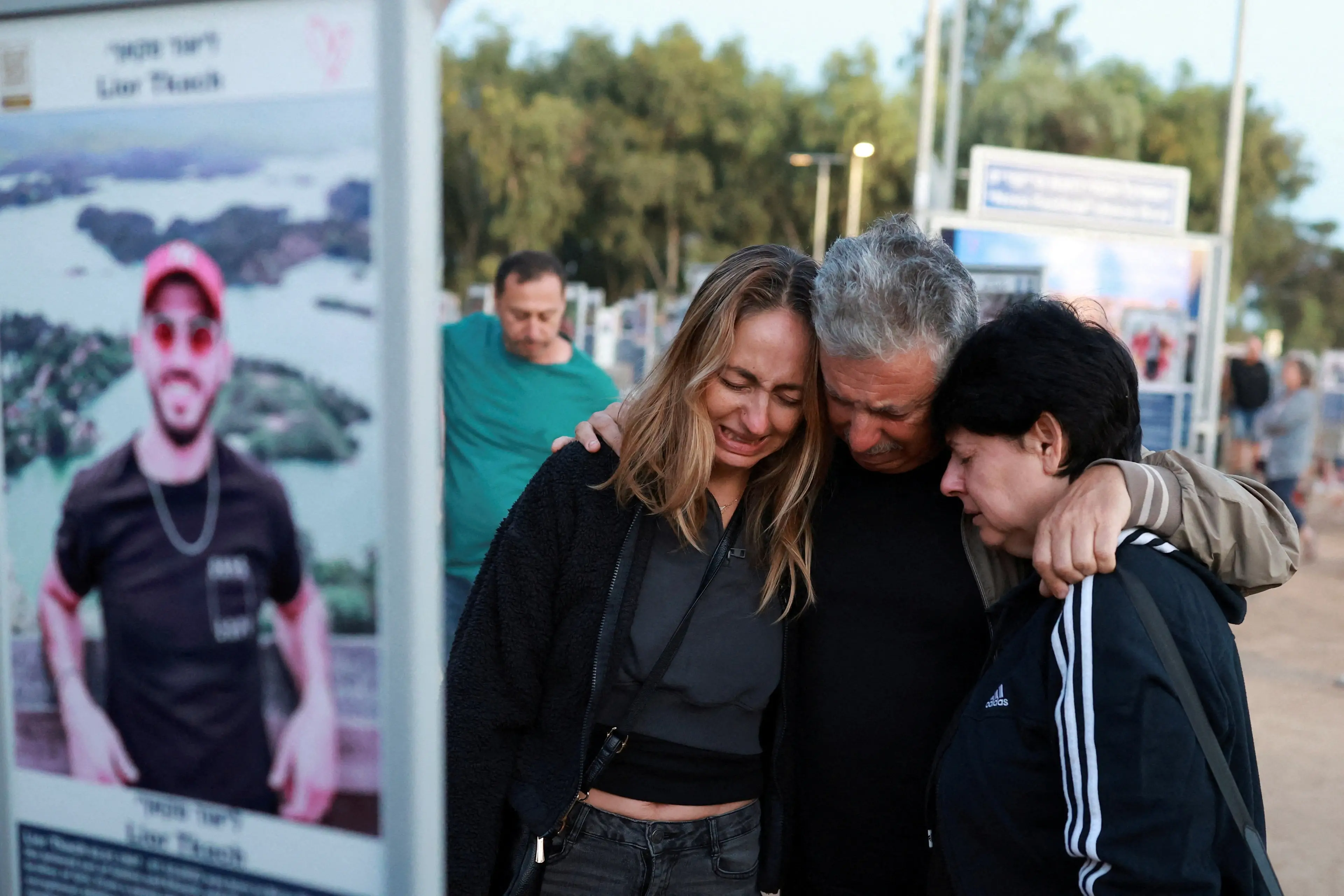 People react as they visit the site of the Nova music festival in southern Israel, where partygoers were killed and kidnapped in the October 7, 2023 attack.