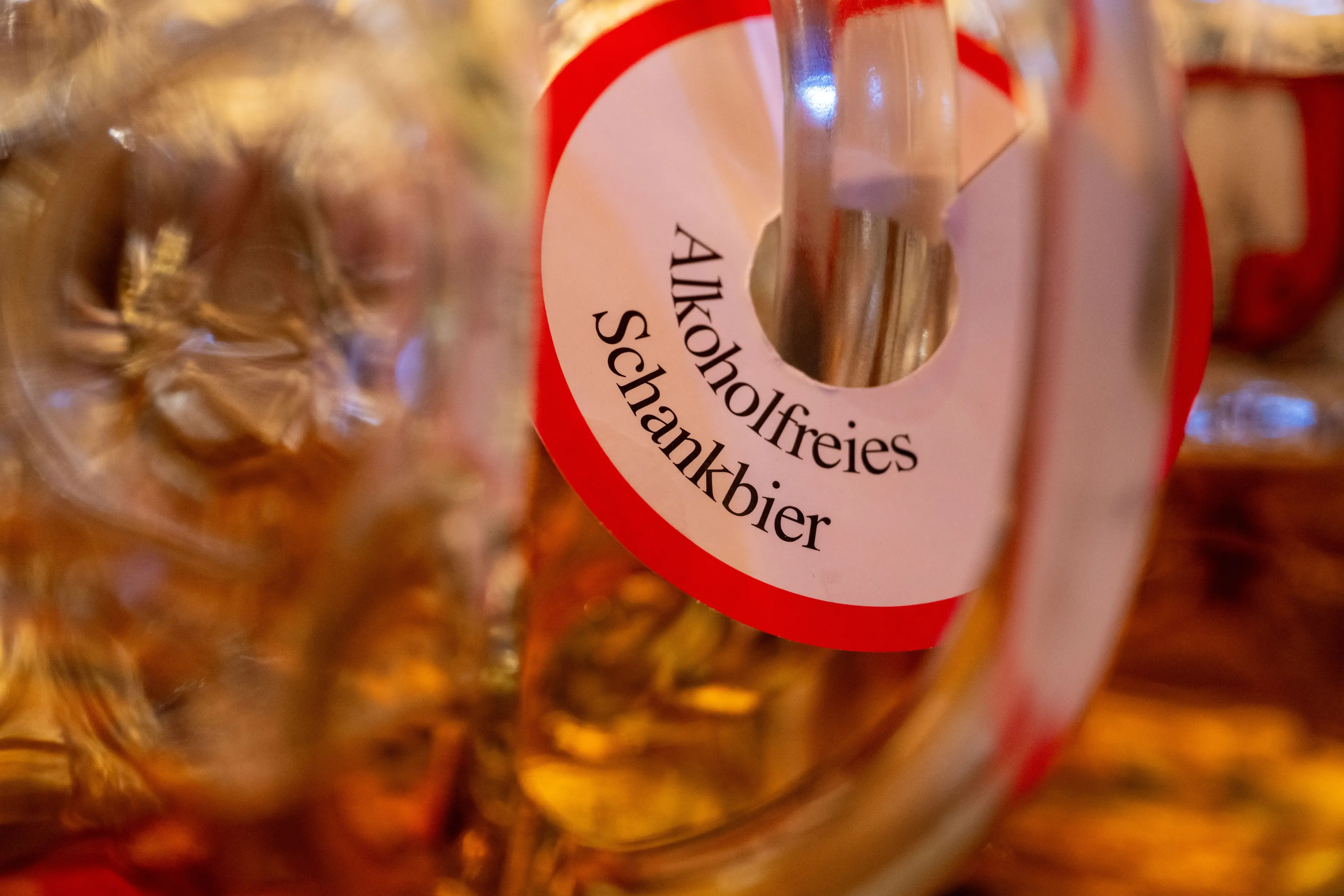 Non-alcoholic beer labels on steins at Oktoberfest in Munich. Photo: Getty
