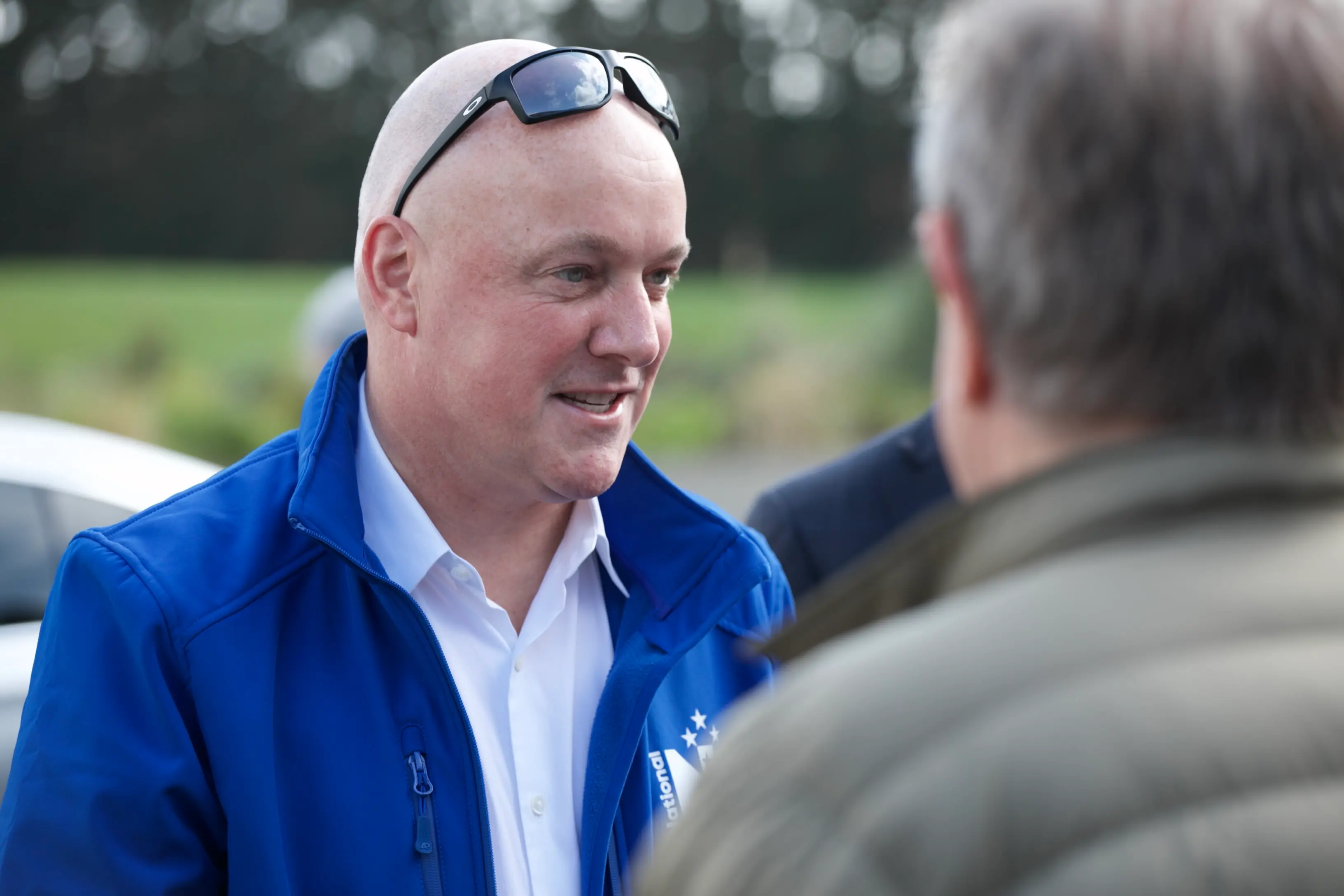 National Party leader Christopher Luxon speaks to people at Oete Goat Farm in Patumahoe, Auckland. Photo: RNZ / Calvin Samuel