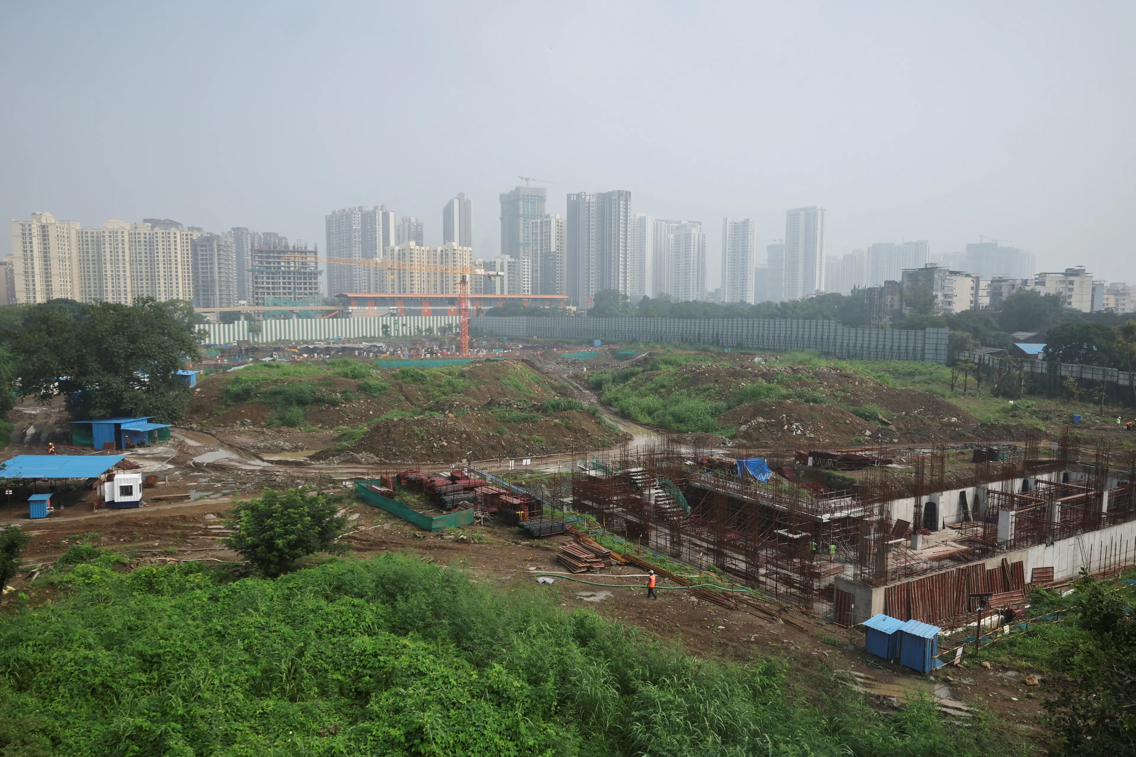A worker walks at the construction site of an Amazon data centre in Thane, India. Photo: Reuters