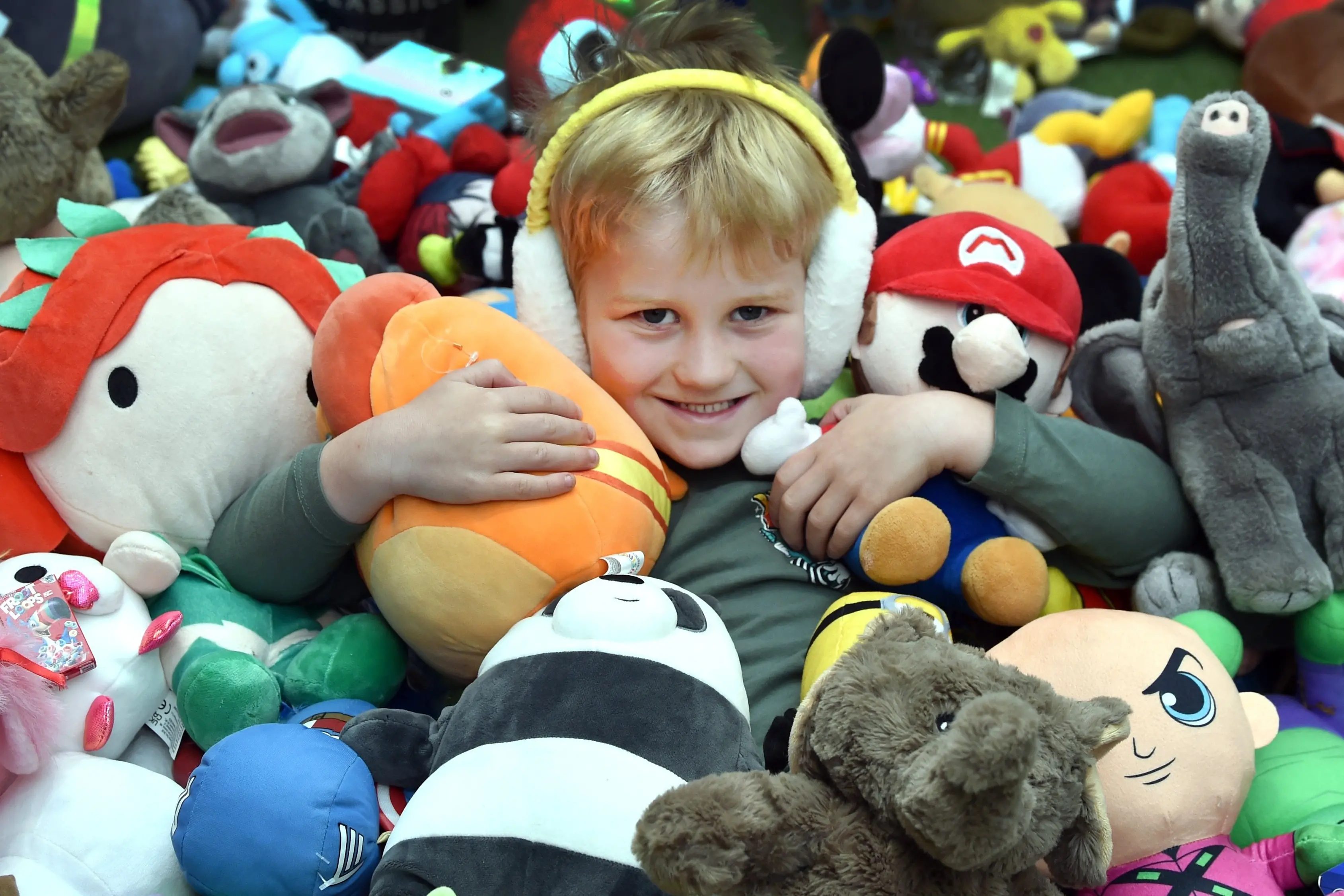 Harlan Gillies, 5, of Dunedin, gets among a bunch of soft toys during the Edgar Centre\\'s first \"car boot sale\" in Dunedin on Saturday. Photo: Peter McIntosh