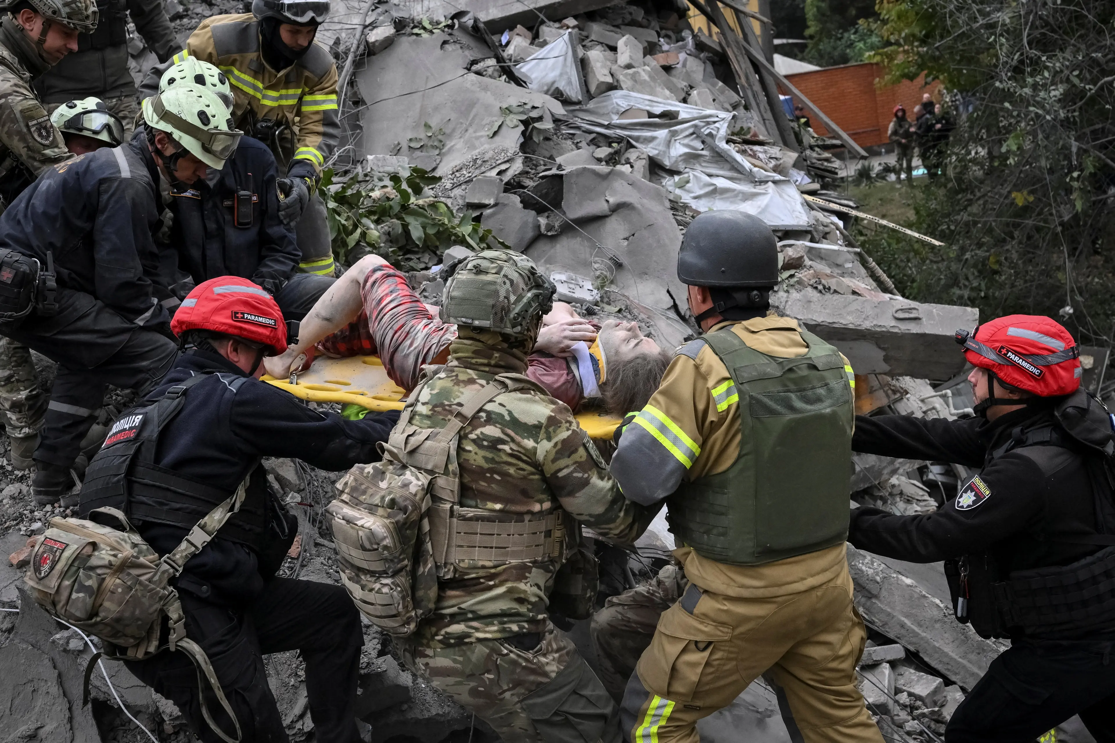 <p>Rescuers evacuate a wounded woman Alina, 22, found under debris of an apartment building damaged during a Russian air strike, amid Russia's attack on Ukraine, in Zaporizhzhia, Ukraine. Photo: Reuters </p>\\n