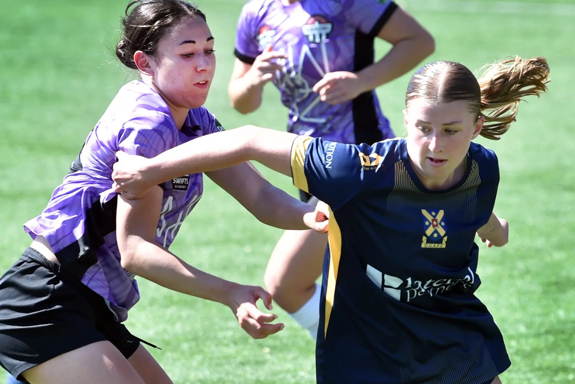 Waterside Karori\\'s Taylor Cooper (left) and Otago University\\'s Shelby Jones battle for the ball during their National League game at Logan Park Turf on Sunday. Photo: Peter McIntosh