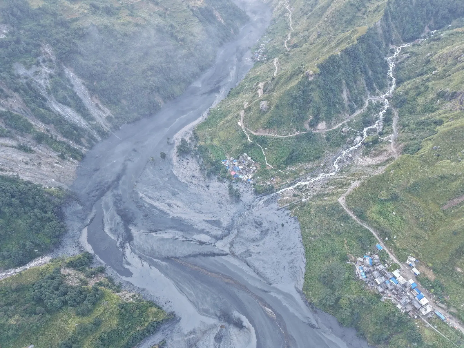 Five missing, evacuations urged after landslide triggers flood in Nepal
