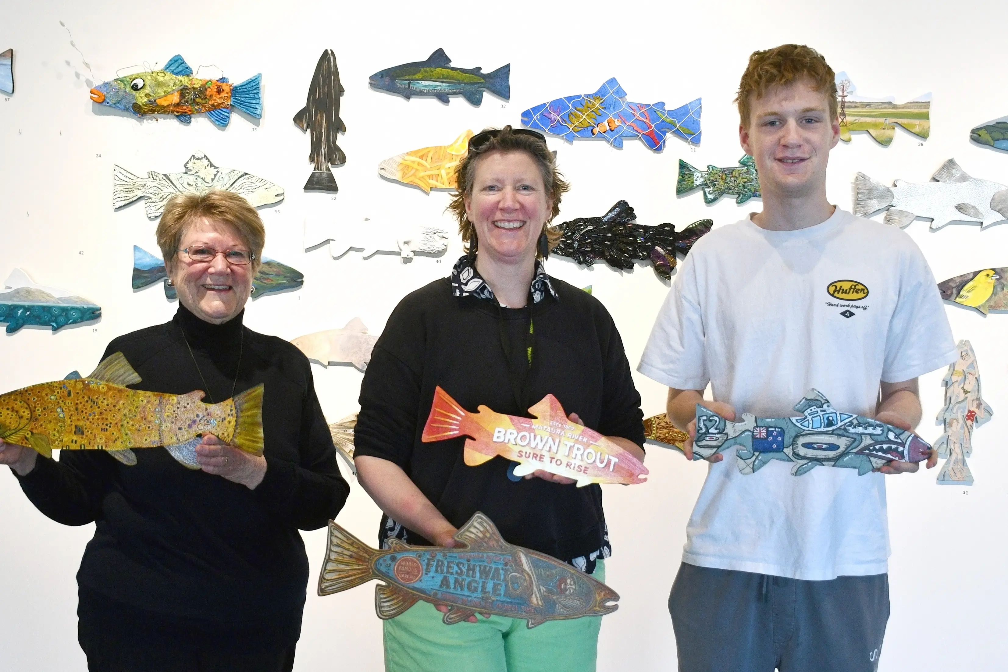 Three generations of artists who crafted trouts as part of the 50 Fish exhibition and auction at the M\\u0101ruawai Centre this month are (from left) mother and daughter Shona and Jacqui Byars, and her son Jude Terry, 17. Photo: Gemma Sinclair