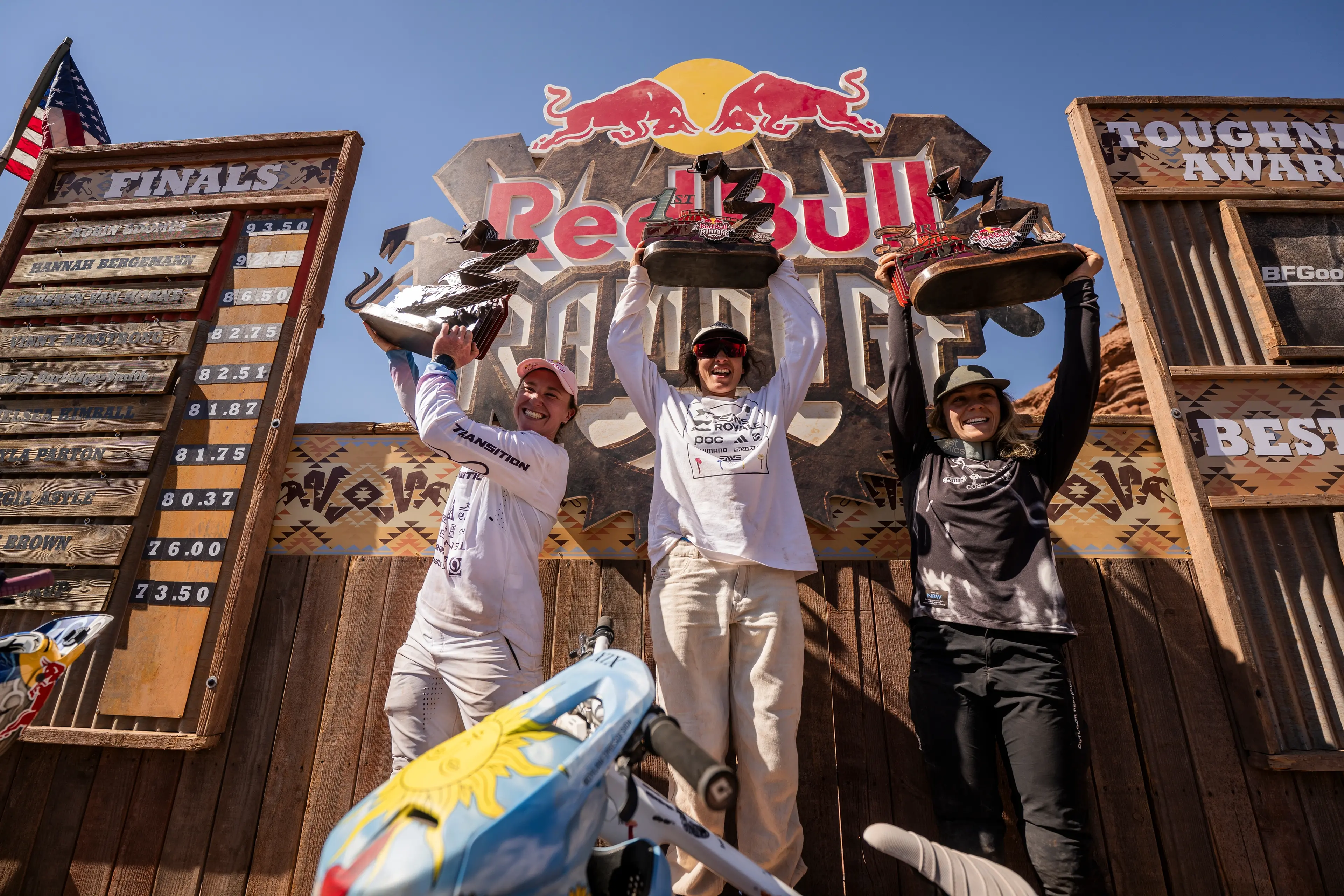 Historic three-peat: Part-time Queenstown mountain biker Robin Goomes, centre, celebrates after becoming the first person to win the Red Bull Rampage three times in a row. She\\'s pictured with Hannah Bergmann of the US, right, who came second, and Canada\\'s Kirsten Van Horne, who finished third. Photo: Bartek Wolinksi/Red Bull Content Pool
